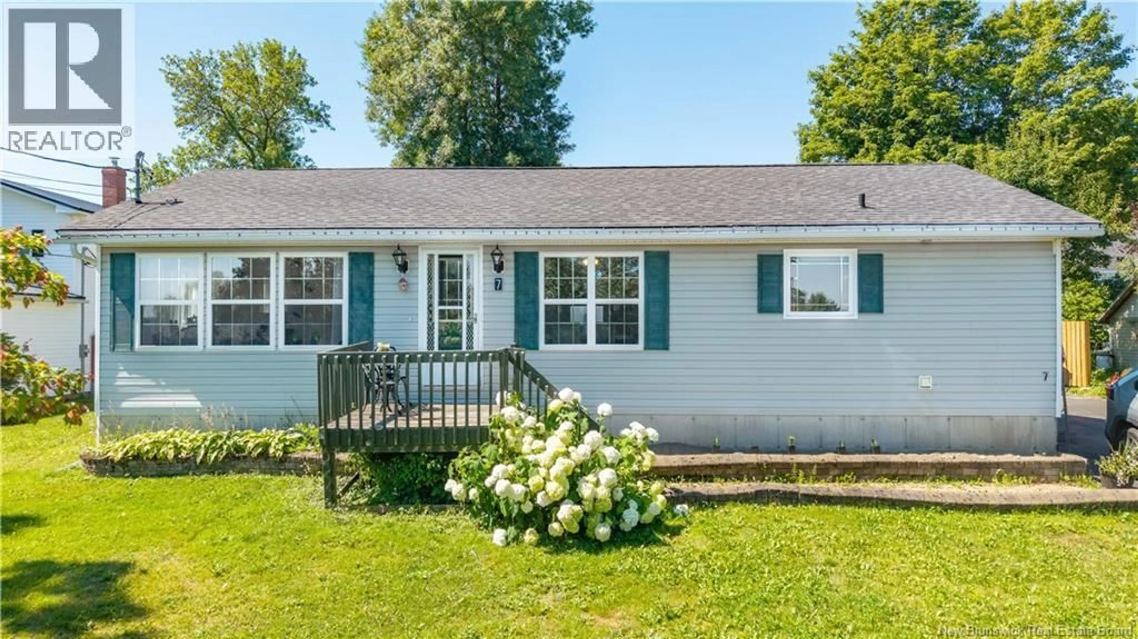 Home with vinyl exterior material, street for 7 MOORES LANE, St. Stephen New Brunswick E3L1C3