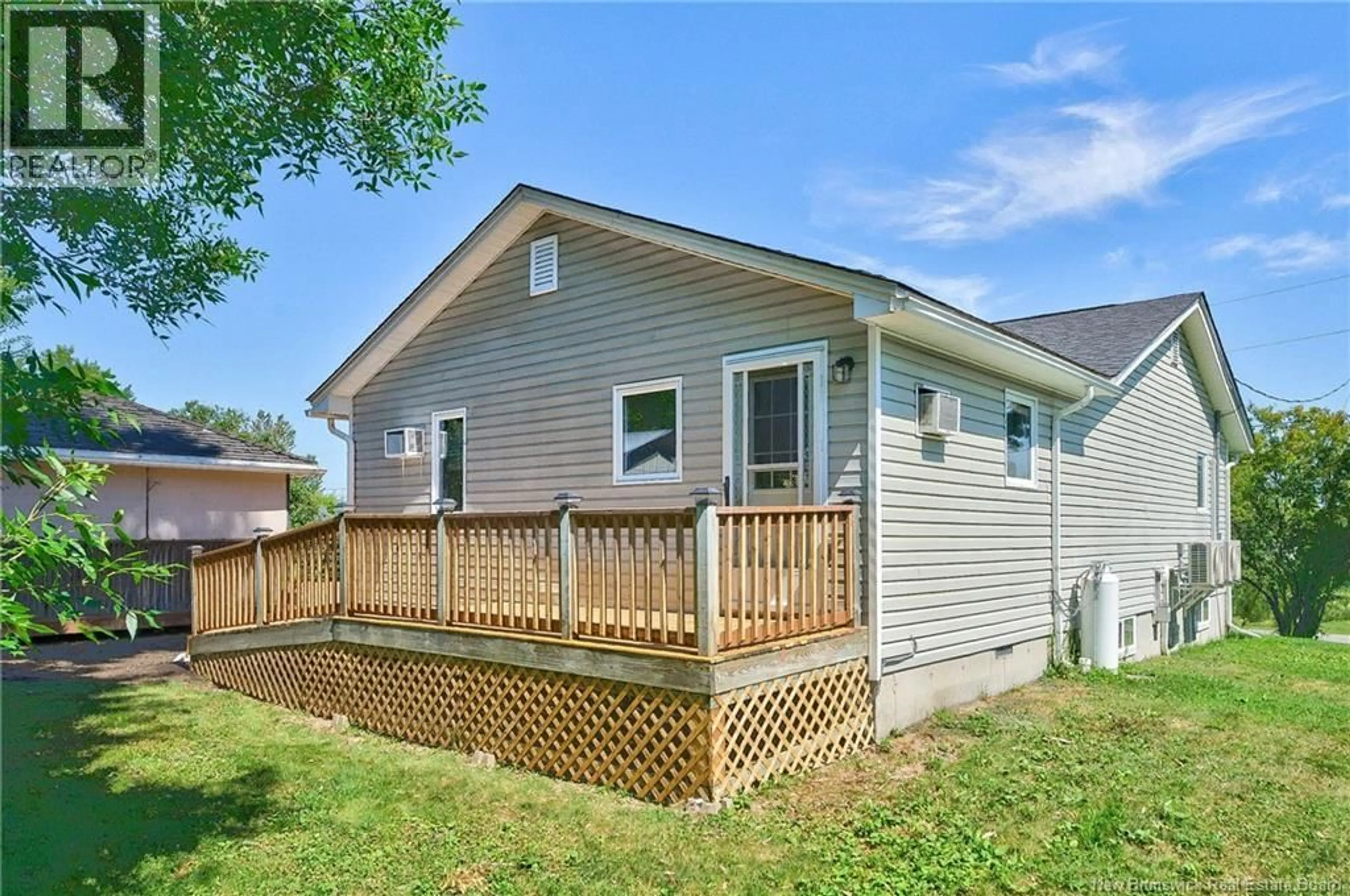 Home with vinyl exterior material, street for 7 MOORES LANE, St. Stephen New Brunswick E3L1C3