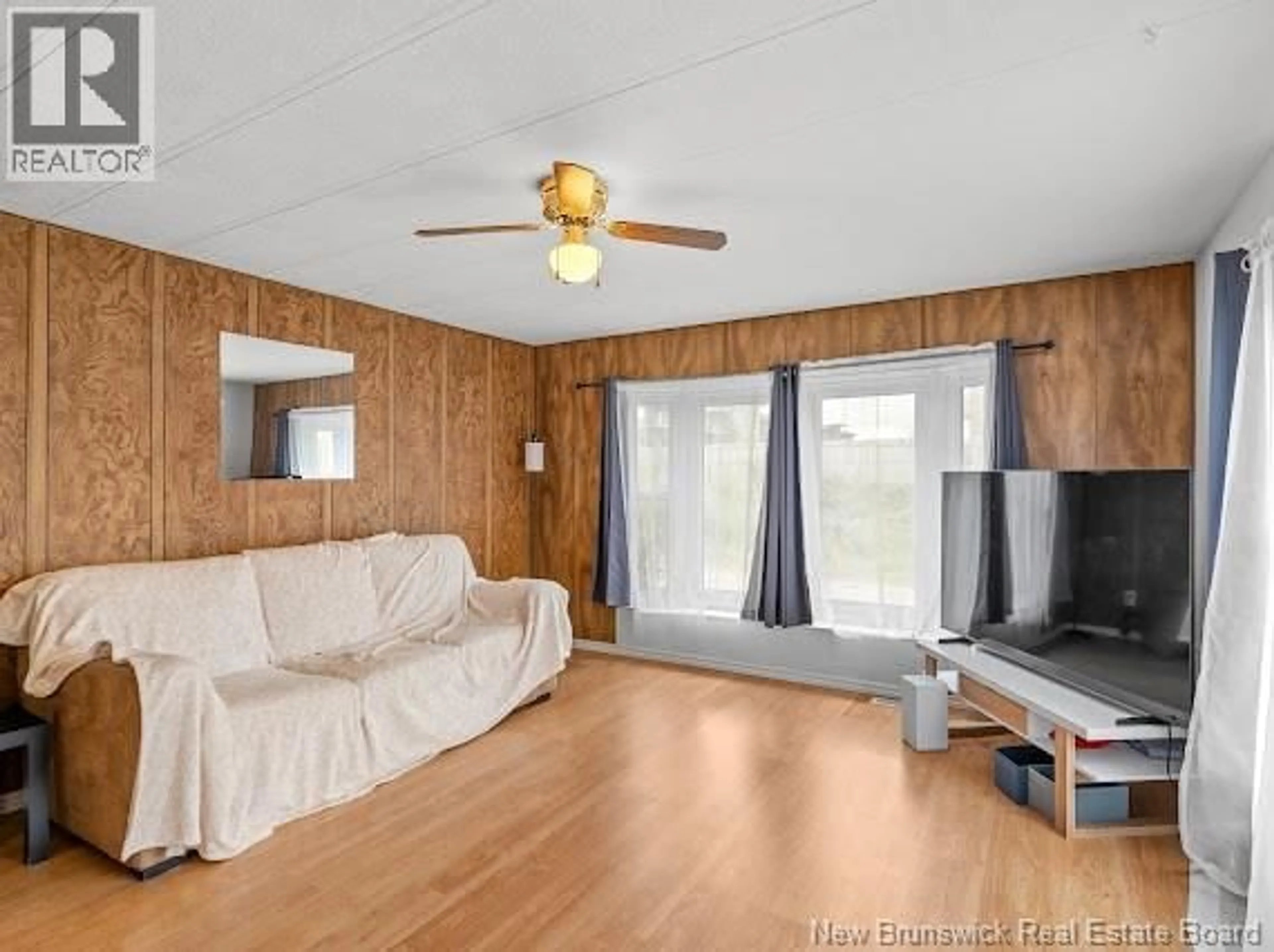 Living room with furniture, wood/laminate floor for 43 MARSH, Moncton New Brunswick E1G1C6