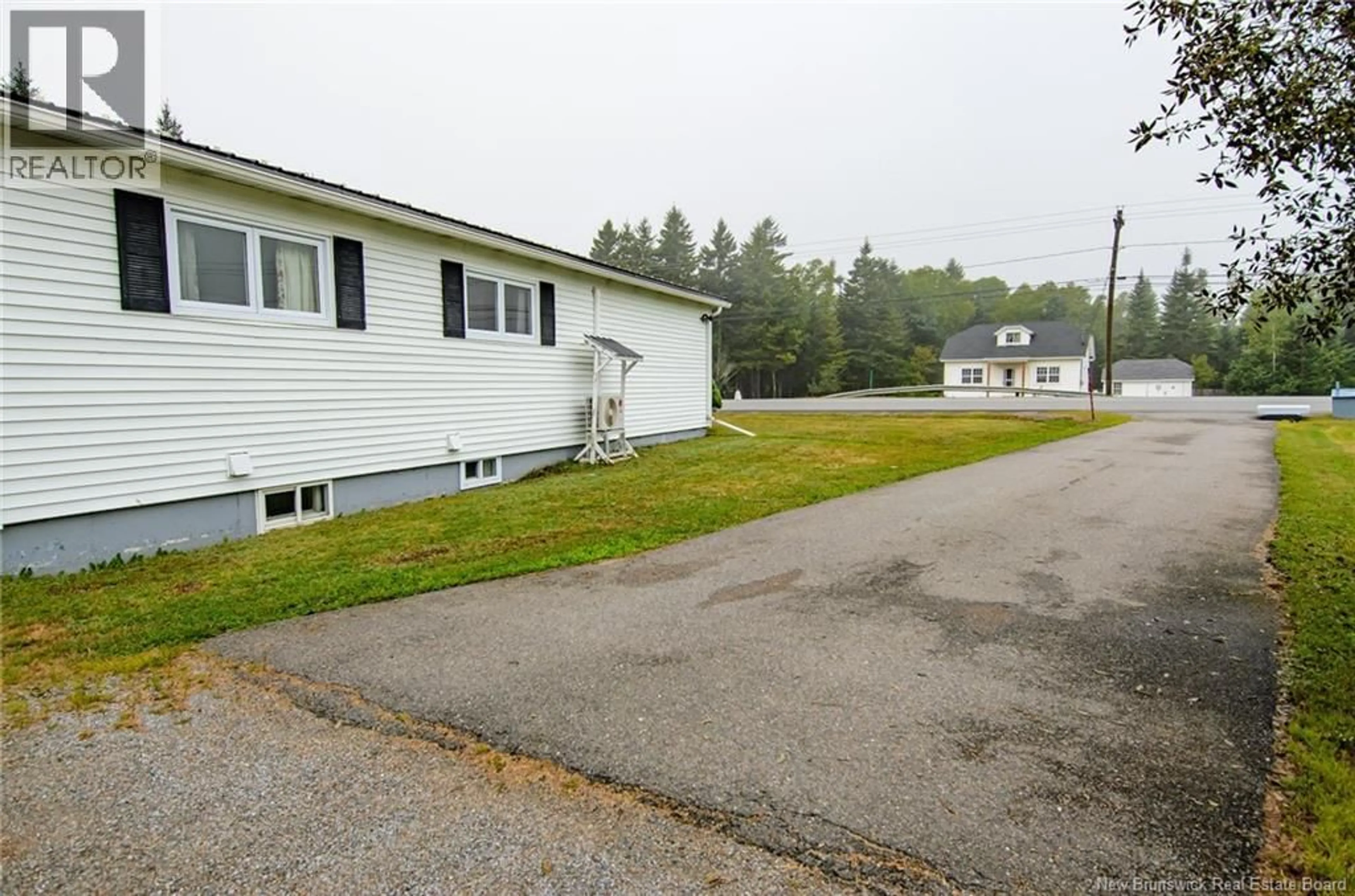 A pic from outside/outdoor area/front of a property/back of a property/a pic from drone, street for 203 ROUTE 176, Pennfield New Brunswick E5H1V1