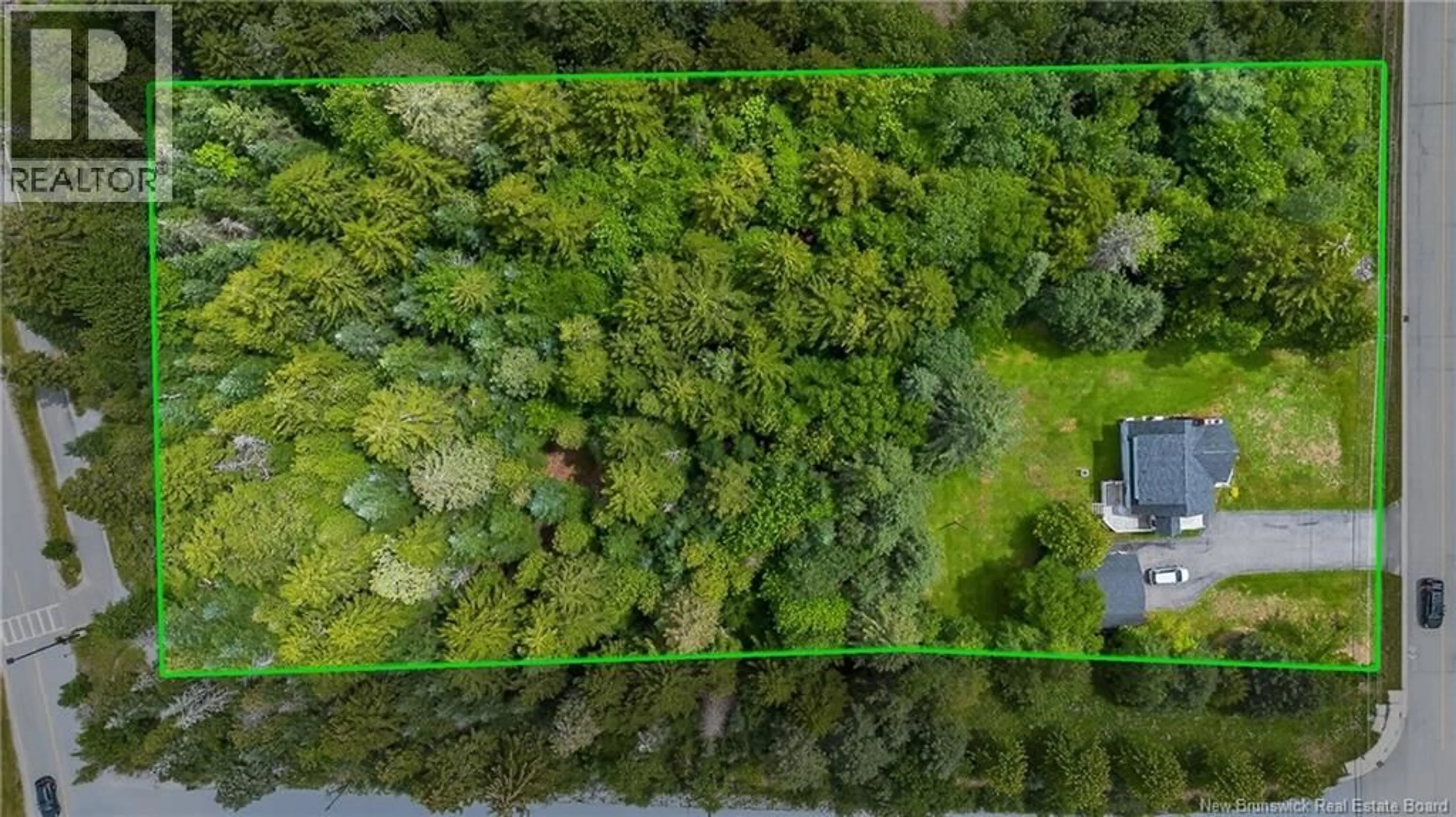 A pic from outside/outdoor area/front of a property/back of a property/a pic from drone, forest/trees view for 85 QUISPAMSIS ROAD, Quispamsis New Brunswick E2E1P1