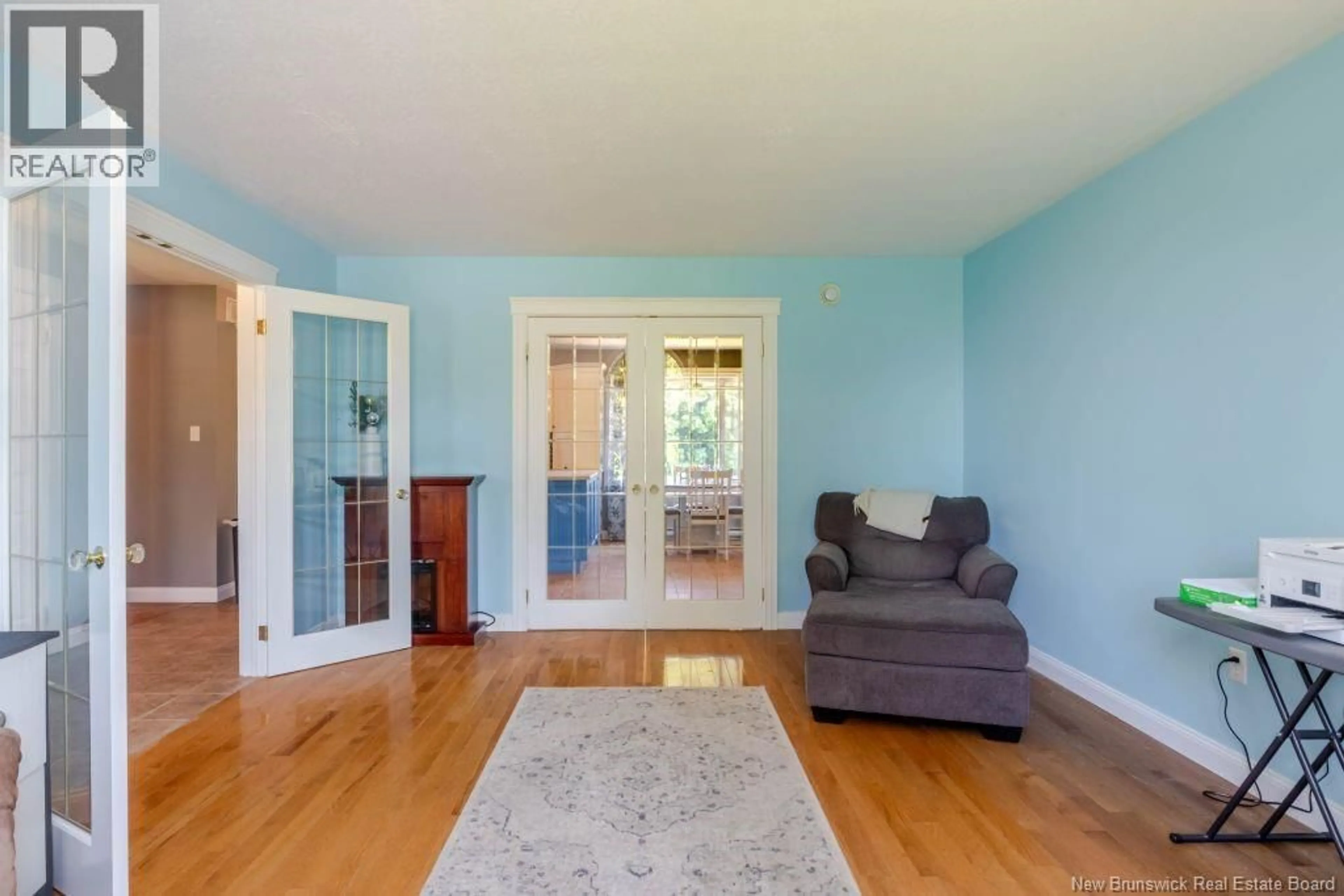 Living room with furniture, wood/laminate floor for 16 RIDGEVIEW DRIVE, Keswick Ridge New Brunswick E6L1K2