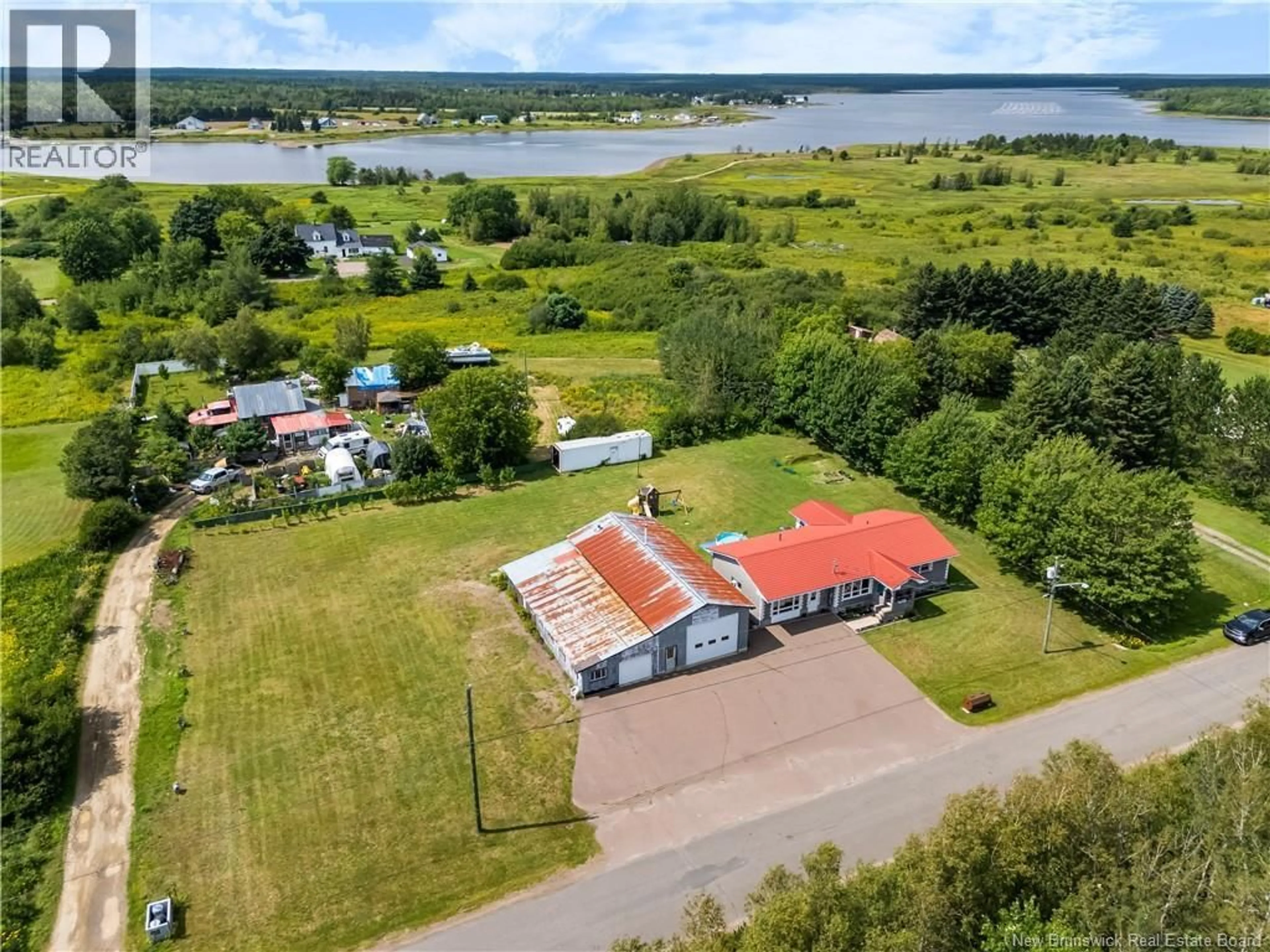 A pic from outside/outdoor area/front of a property/back of a property/a pic from drone, water/lake/river/ocean view for 31-33 BEN DAIGLE, Aldouane New Brunswick E4W5A3