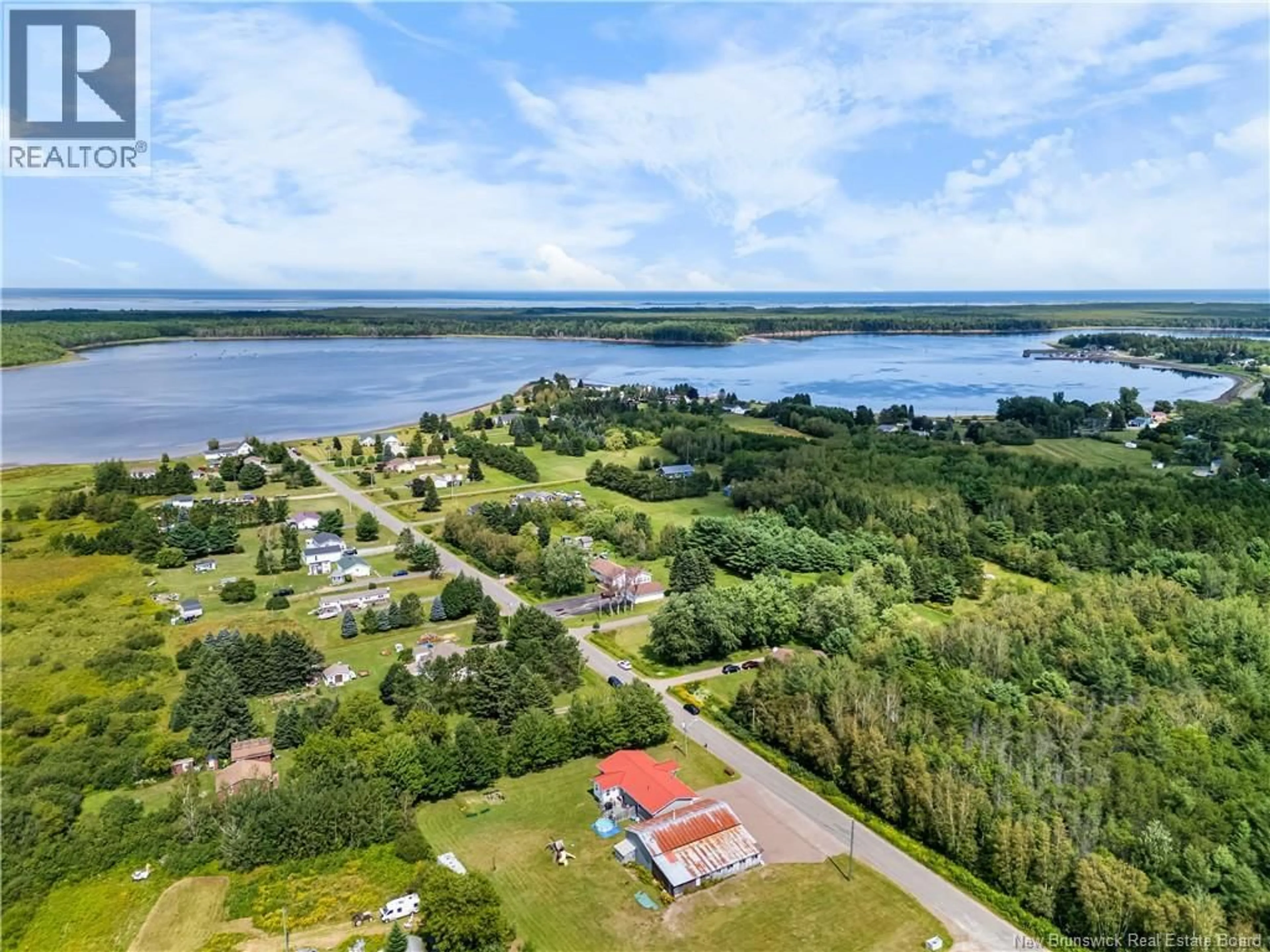 A pic from outside/outdoor area/front of a property/back of a property/a pic from drone, water/lake/river/ocean view for 31-33 BEN DAIGLE, Aldouane New Brunswick E4W5A3