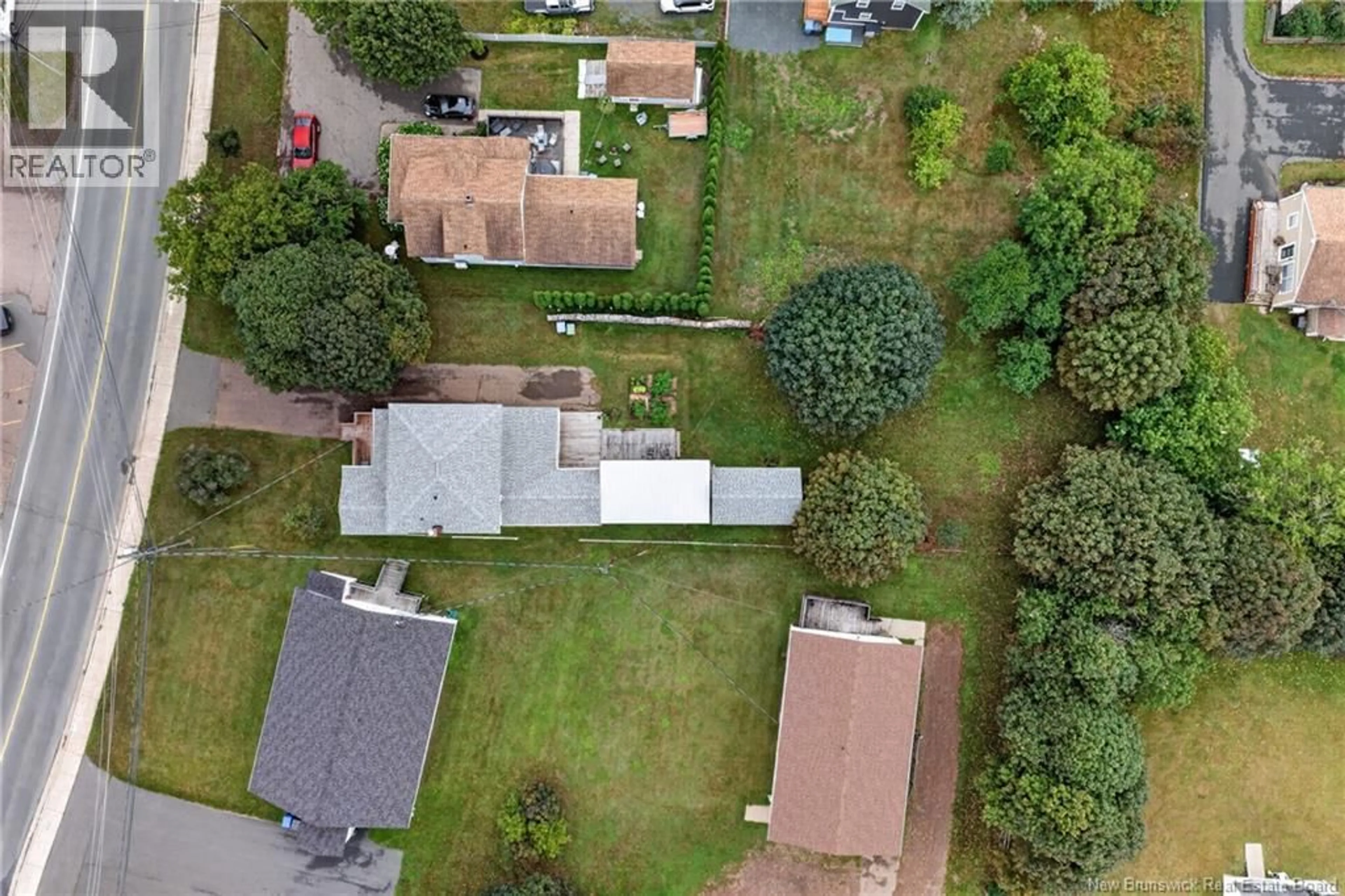 A pic from outside/outdoor area/front of a property/back of a property/a pic from drone, street for 3483 DR VICTOR LEBLANC, Tracadie New Brunswick E1X1C8