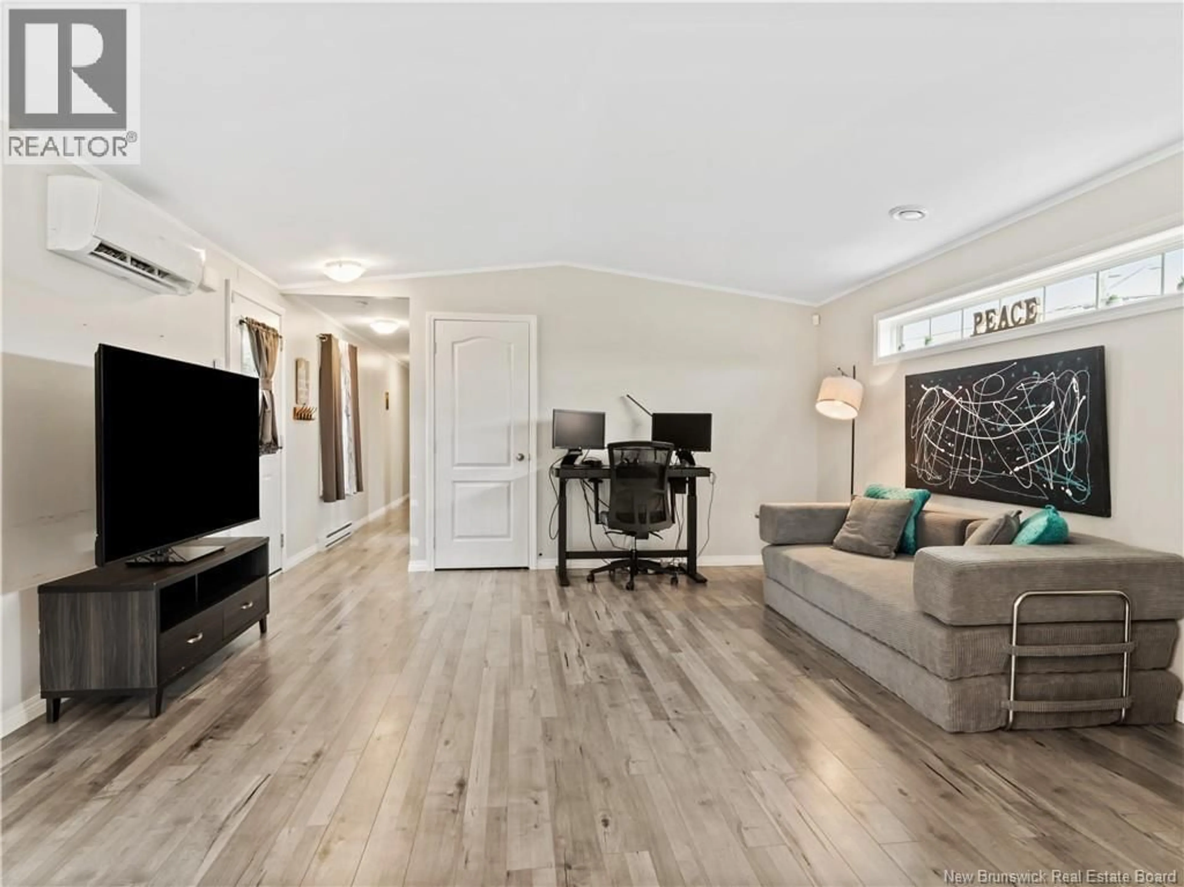 Living room with furniture, wood/laminate floor for 14 TELEX, Dieppe New Brunswick E1A8H5