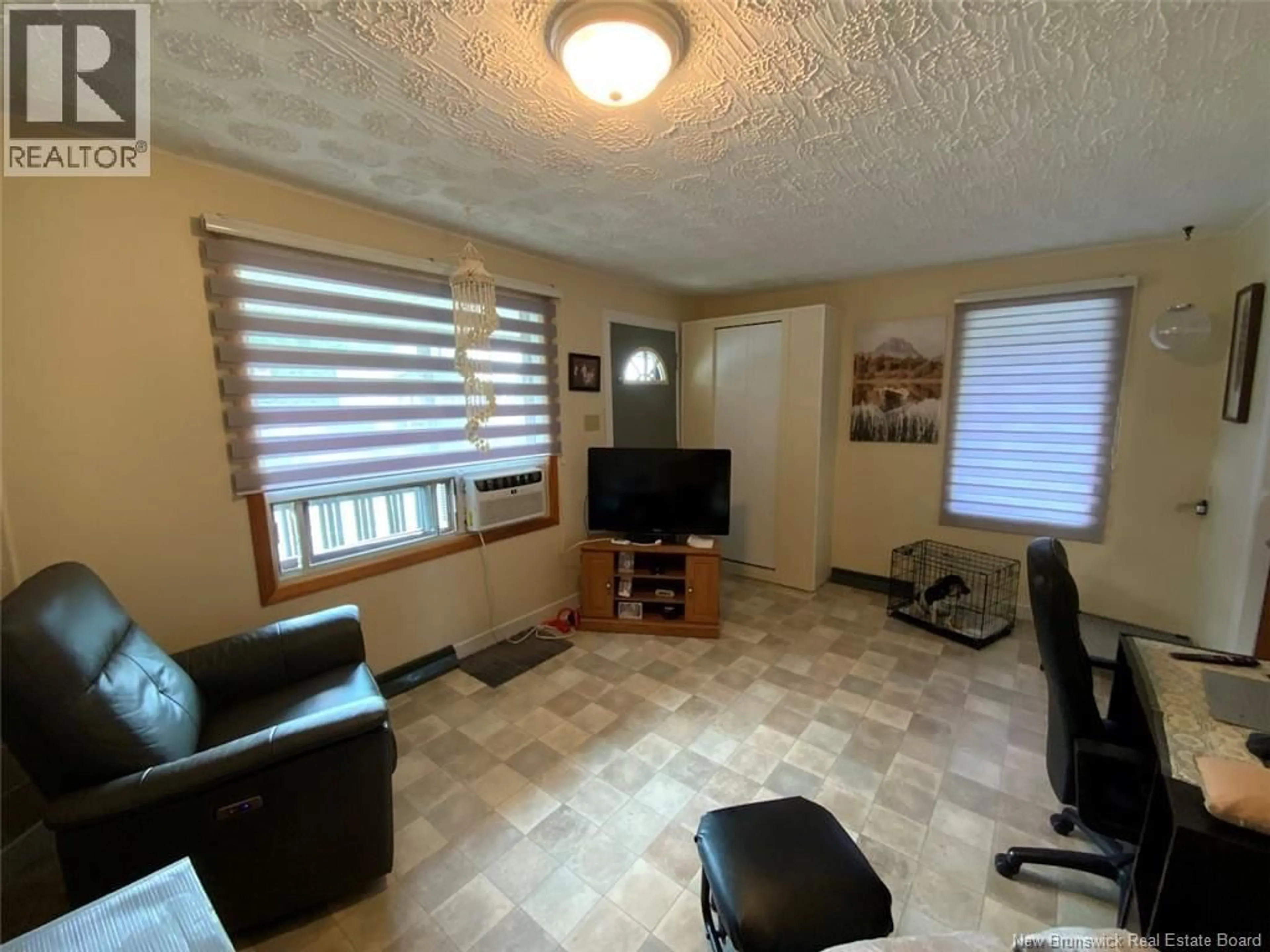Living room with furniture, unknown for 92 DU POUVOIR ROAD, Edmundston New Brunswick E3V2X9