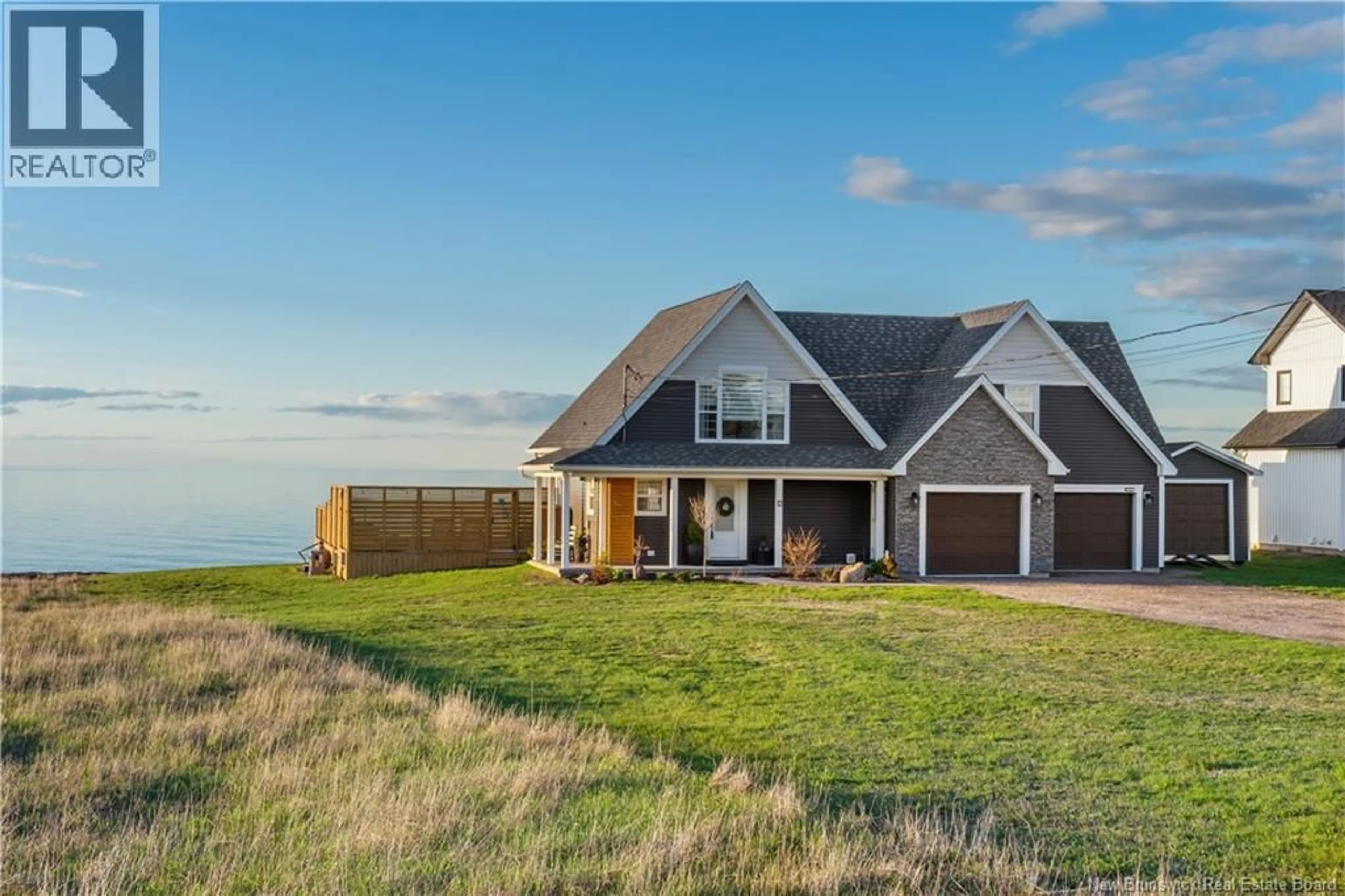 A pic from outside/outdoor area/front of a property/back of a property/a pic from drone, water/lake/river/ocean view for 12 MACON LANE, Cap-Pelé New Brunswick E4P1X2