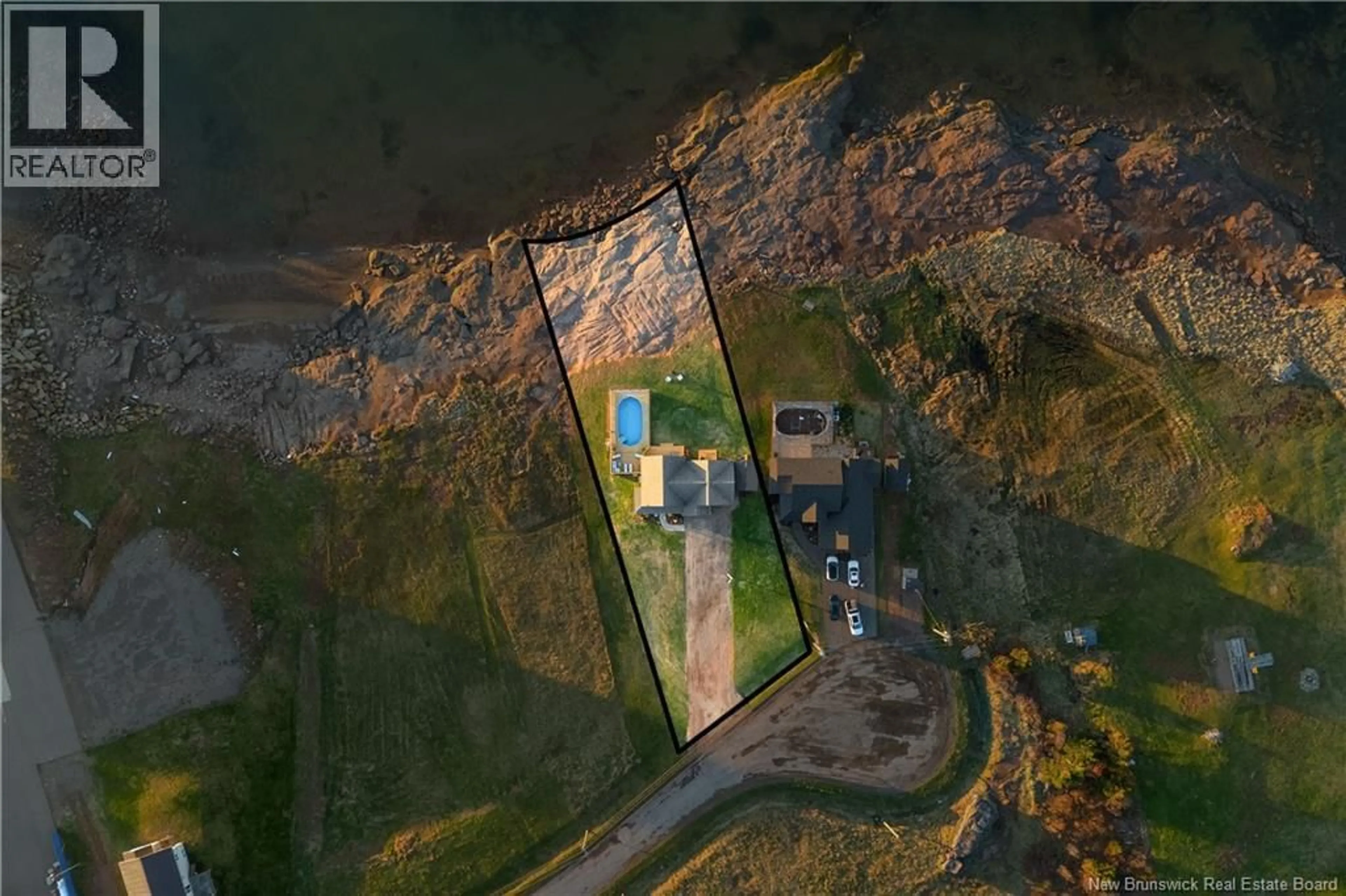 A pic from outside/outdoor area/front of a property/back of a property/a pic from drone, water/lake/river/ocean view for 12 MACON LANE, Cap-Pelé New Brunswick E4P1X2