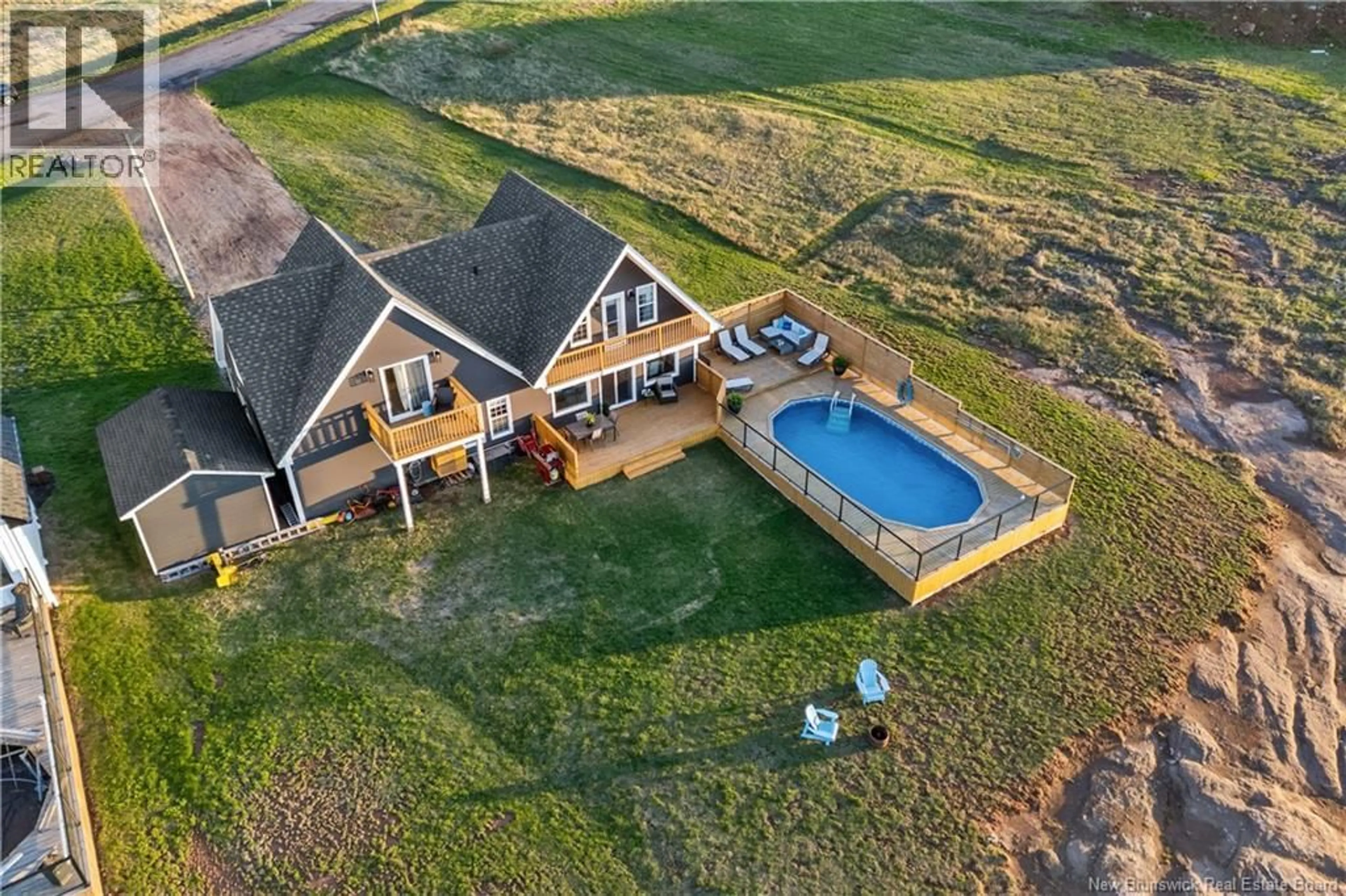A pic from outside/outdoor area/front of a property/back of a property/a pic from drone, water/lake/river/ocean view for 12 MACON LANE, Cap-Pelé New Brunswick E4P1X2