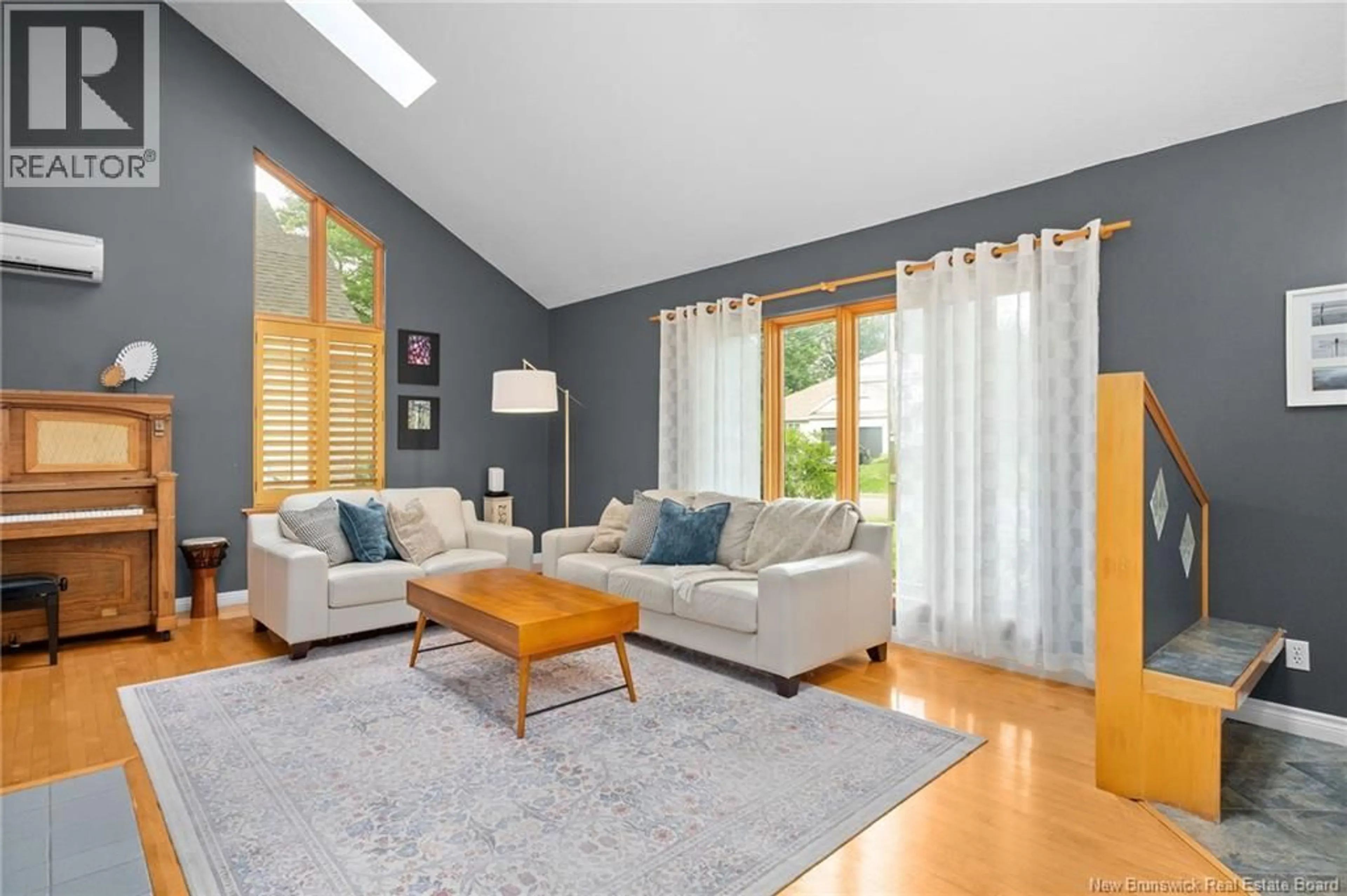 Living room with furniture, wood/laminate floor for 24 MOREWOOD CRESCENT, Moncton New Brunswick E1A6L6