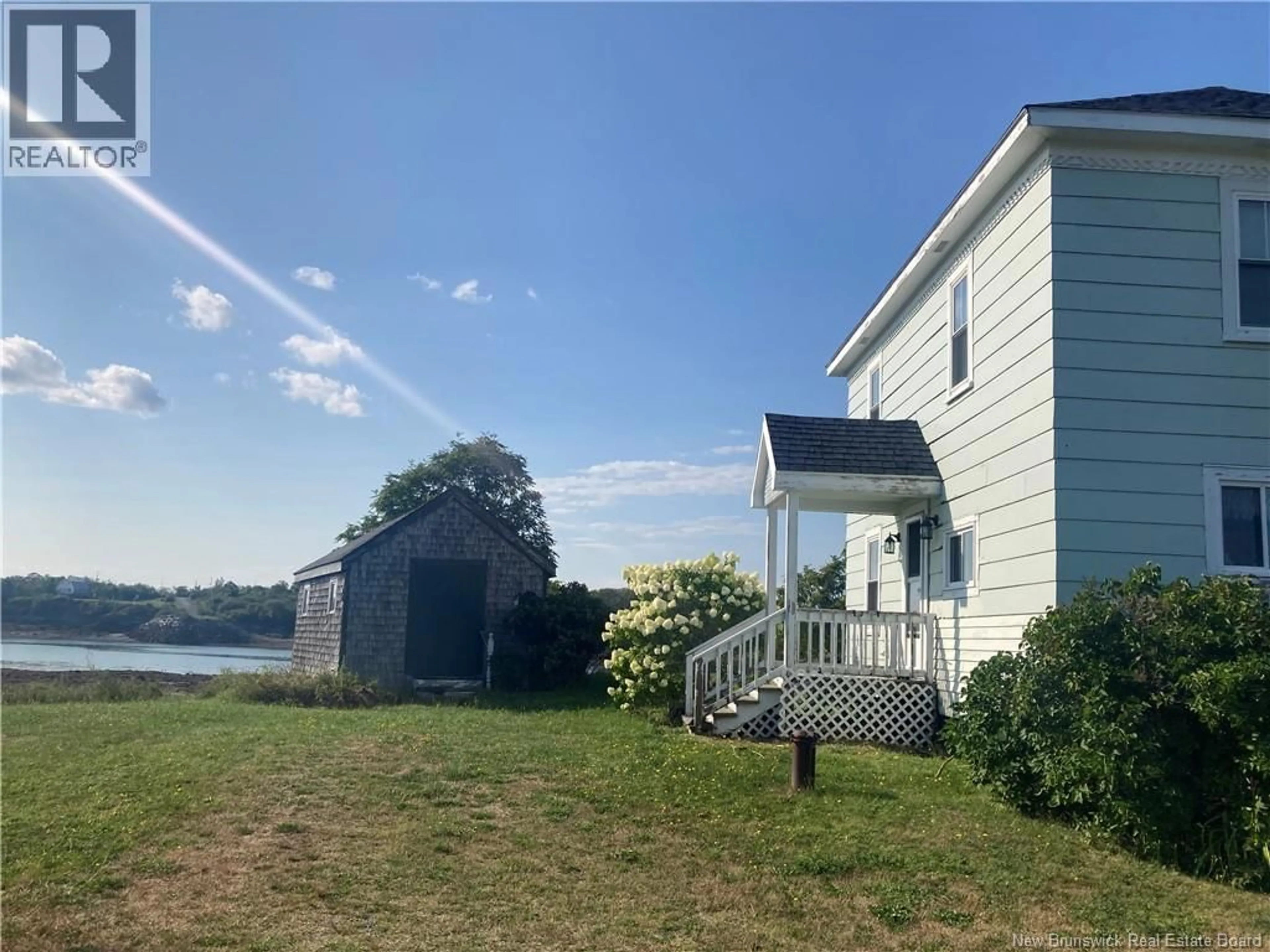 A pic from outside/outdoor area/front of a property/back of a property/a pic from drone, water/lake/river/ocean view for 26 OLLO CALDERS LANE, Wilsons Beach New Brunswick E5E1S4