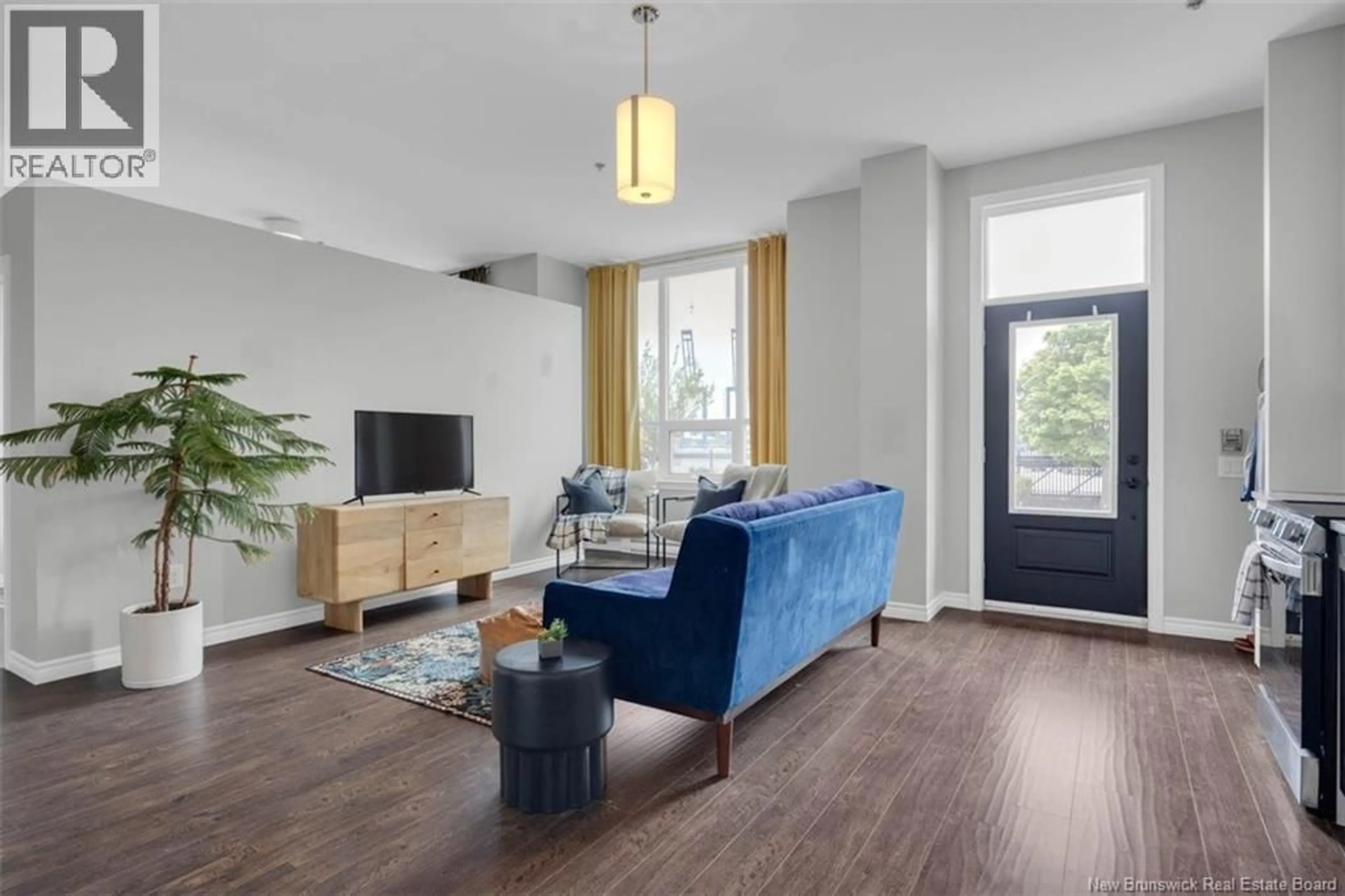 Living room with furniture, wood/laminate floor for 102 - 242 WATER STREET, Saint John New Brunswick E2L0C5