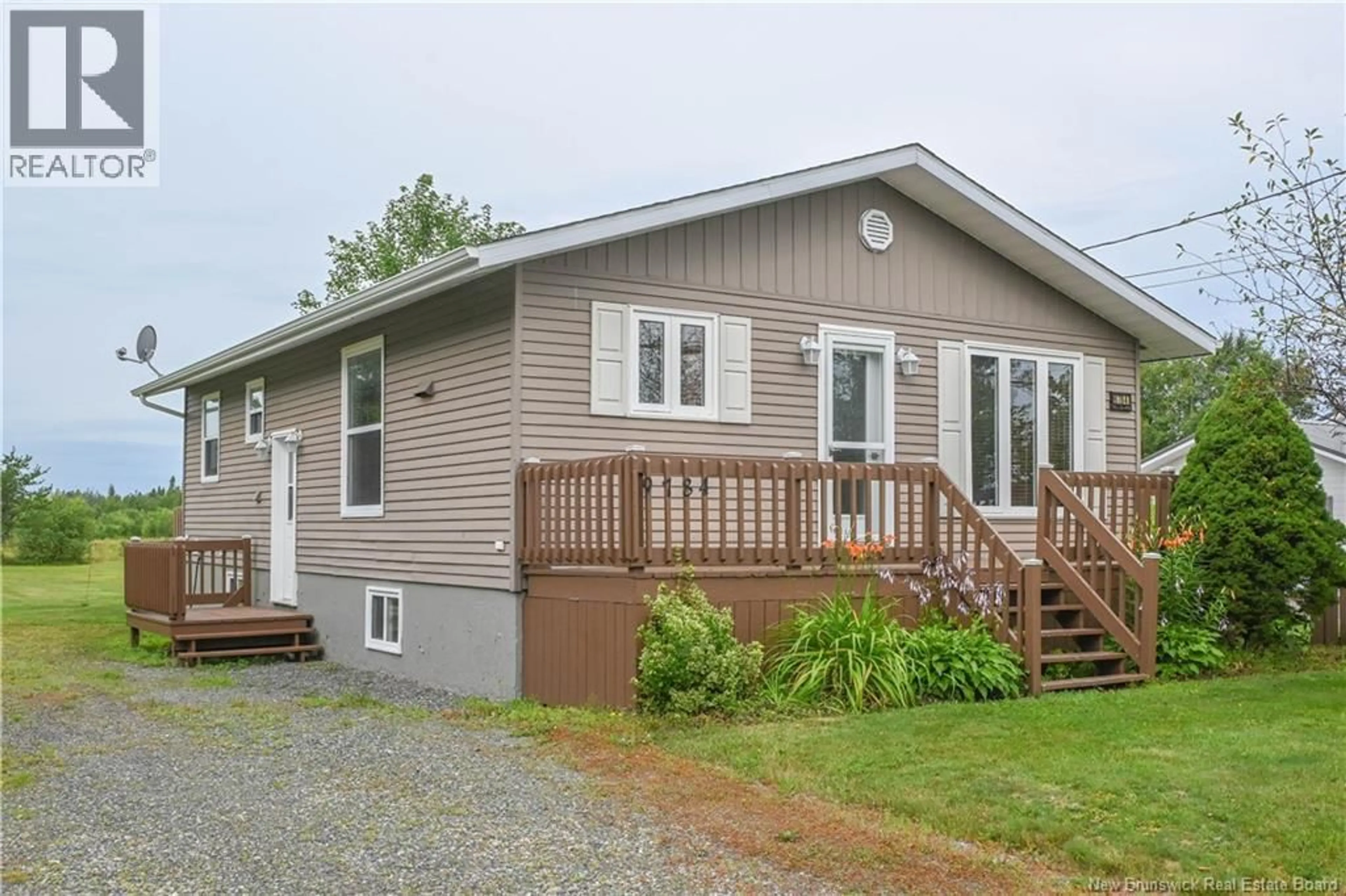 Home with vinyl exterior material, street for 9784 ROUTE 145, Pokesudie New Brunswick E1W5S4