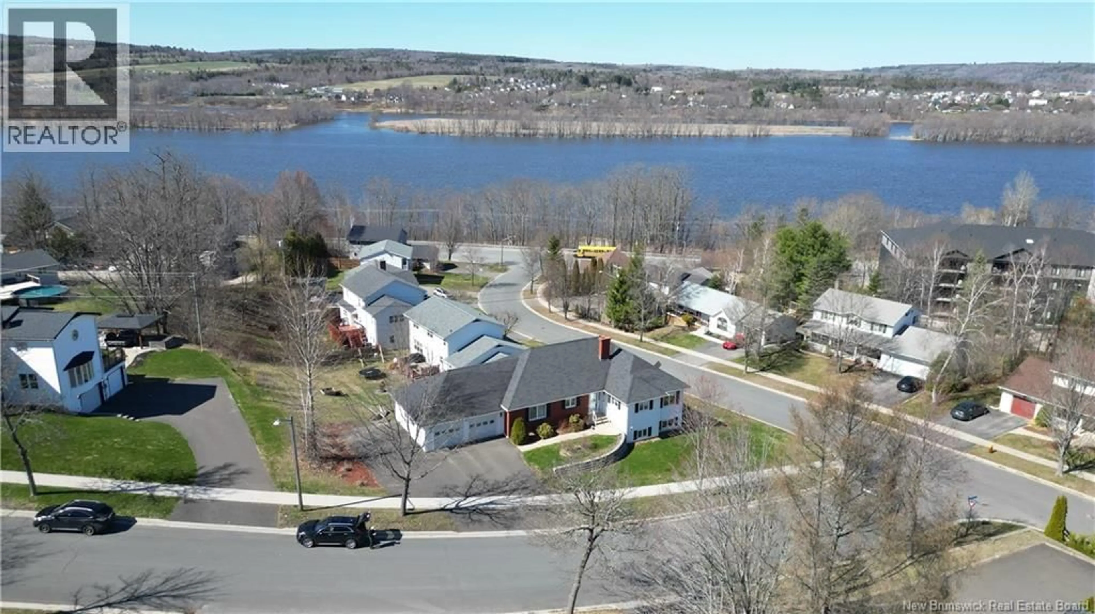 A pic from outside/outdoor area/front of a property/back of a property/a pic from drone, water/lake/river/ocean view for 15 TALISMAN CRESCENT, Fredericton New Brunswick E3C1L9