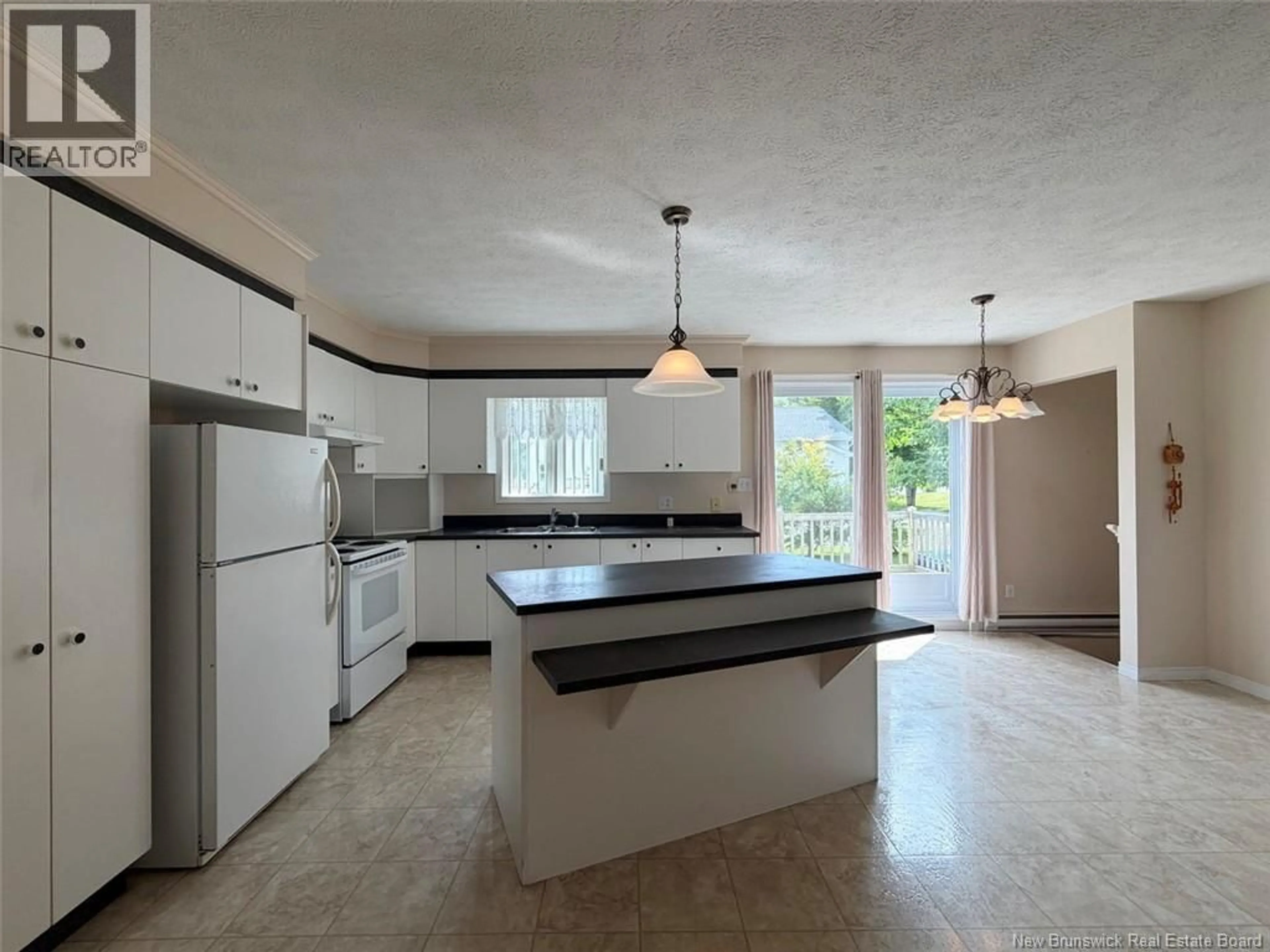 Open concept kitchen, ceramic/tile floor for 45 BEAULIEU STREET, Saint-Quentin New Brunswick E8A1B5