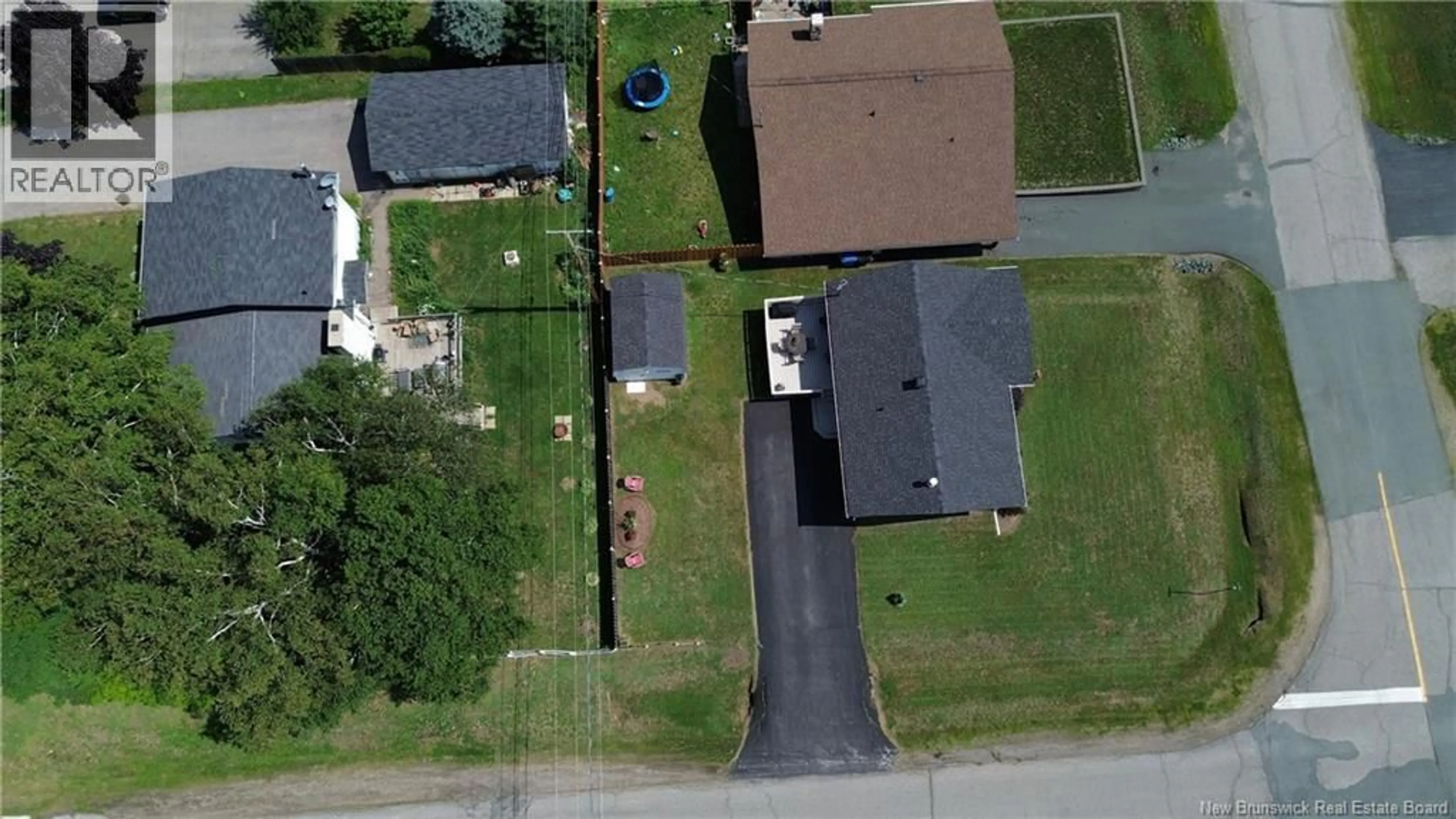 A pic from outside/outdoor area/front of a property/back of a property/a pic from drone, street for 1190 ROCKLAND DRIVE, Bathurst New Brunswick E2A3T9