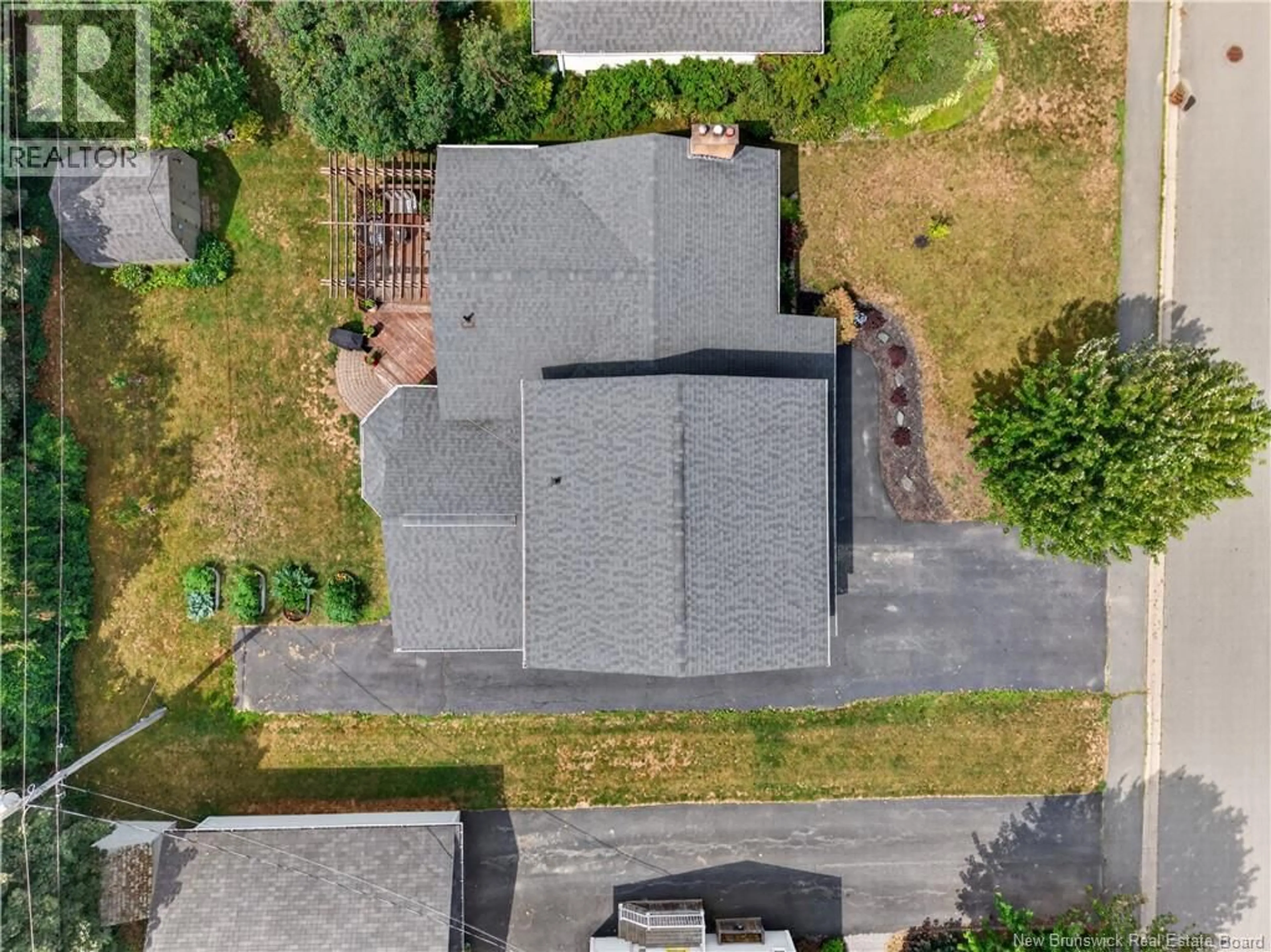 A pic from outside/outdoor area/front of a property/back of a property/a pic from drone, street for 293 MILLAR AVENUE, Miramichi New Brunswick E1V3B7
