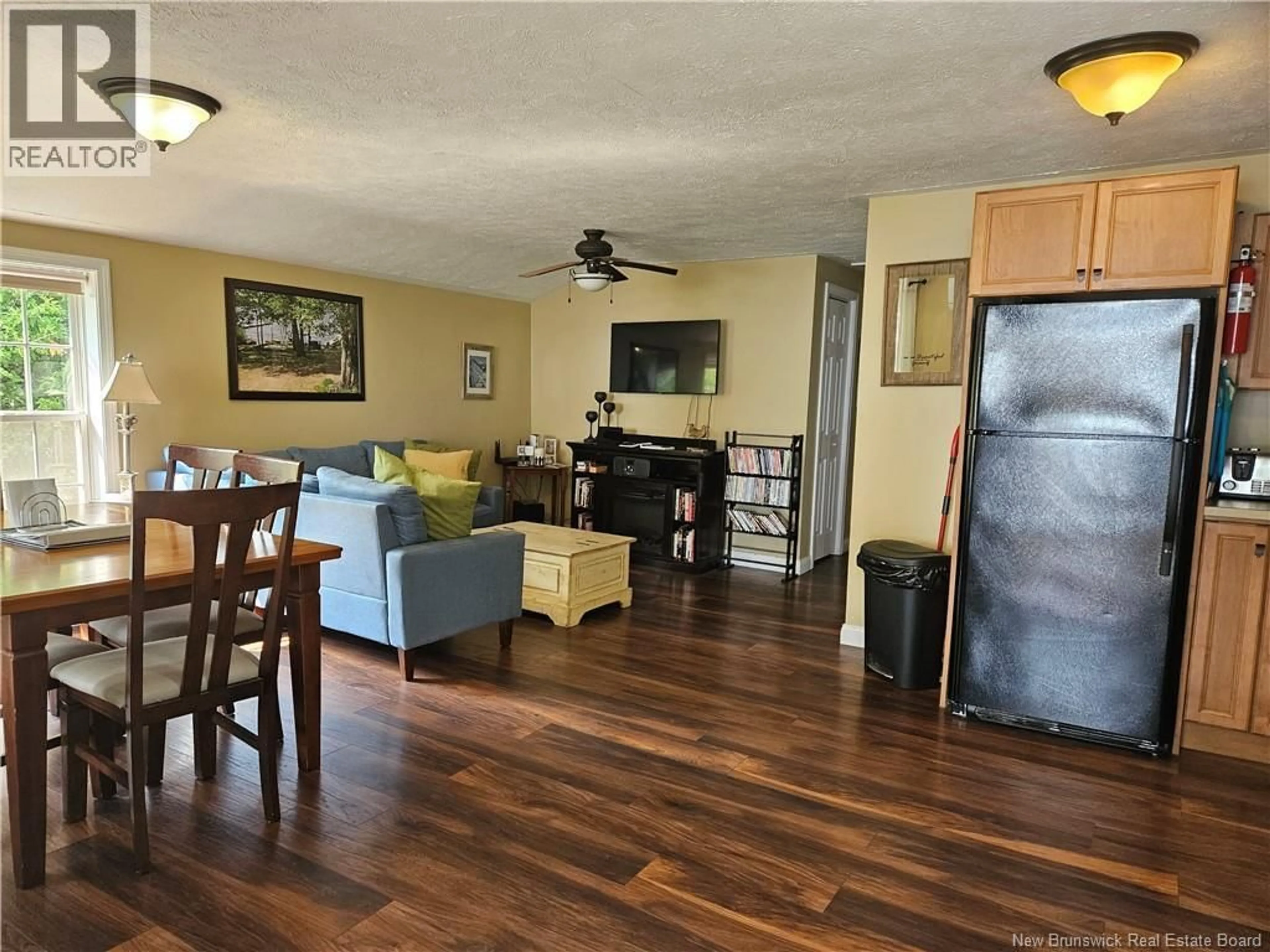 Living room with furniture, wood/laminate floor for 44 SHORE ROAD, Clarks Corner New Brunswick E4B1R8