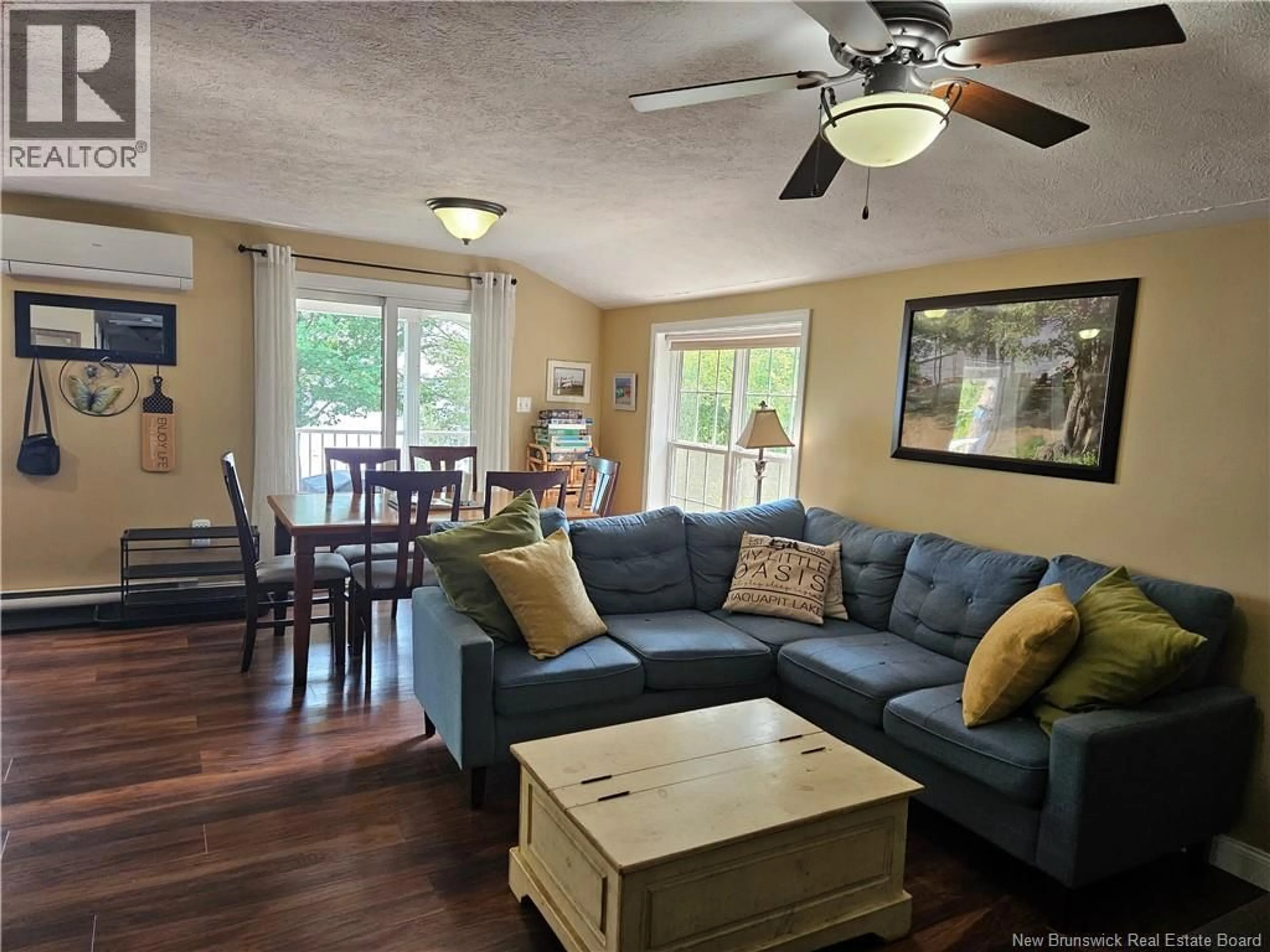 Living room with furniture, wood/laminate floor for 44 SHORE ROAD, Clarks Corner New Brunswick E4B1R8