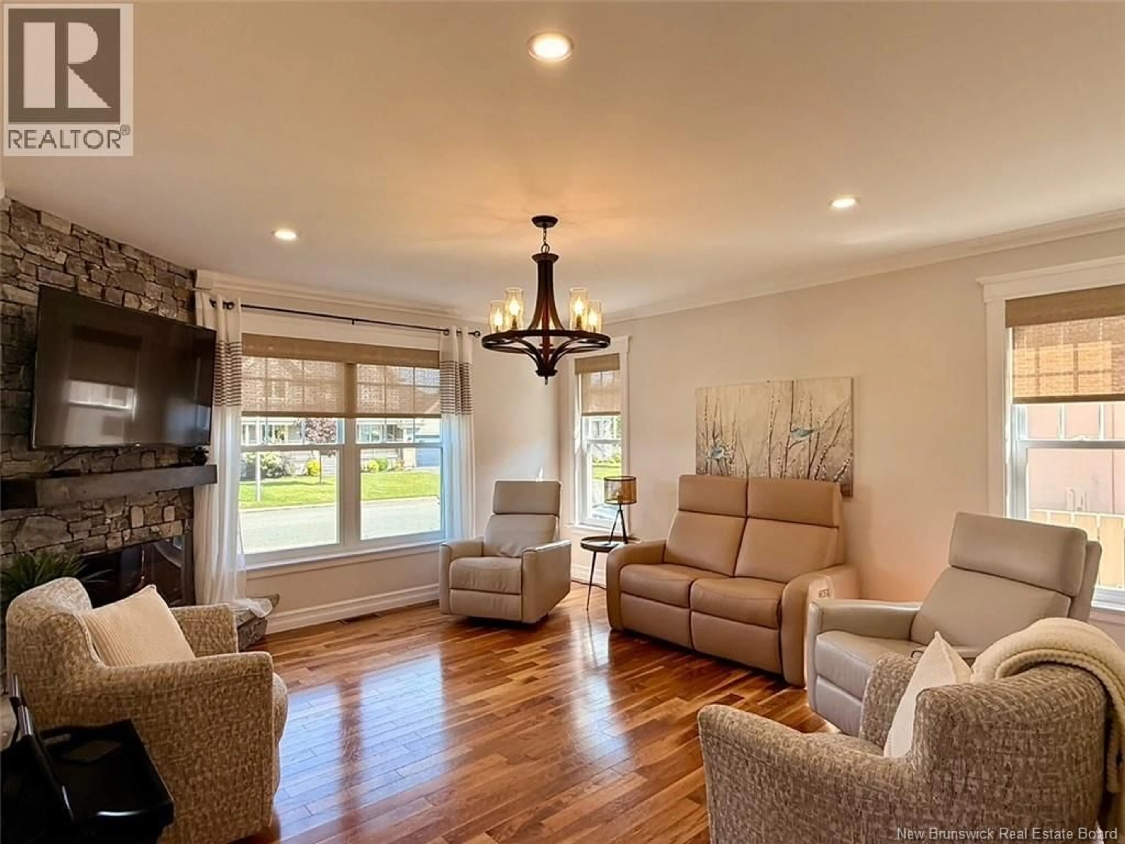 Living room with furniture, wood/laminate floor for 28 BROOK TERRACE, Campbellton New Brunswick E3N3T3