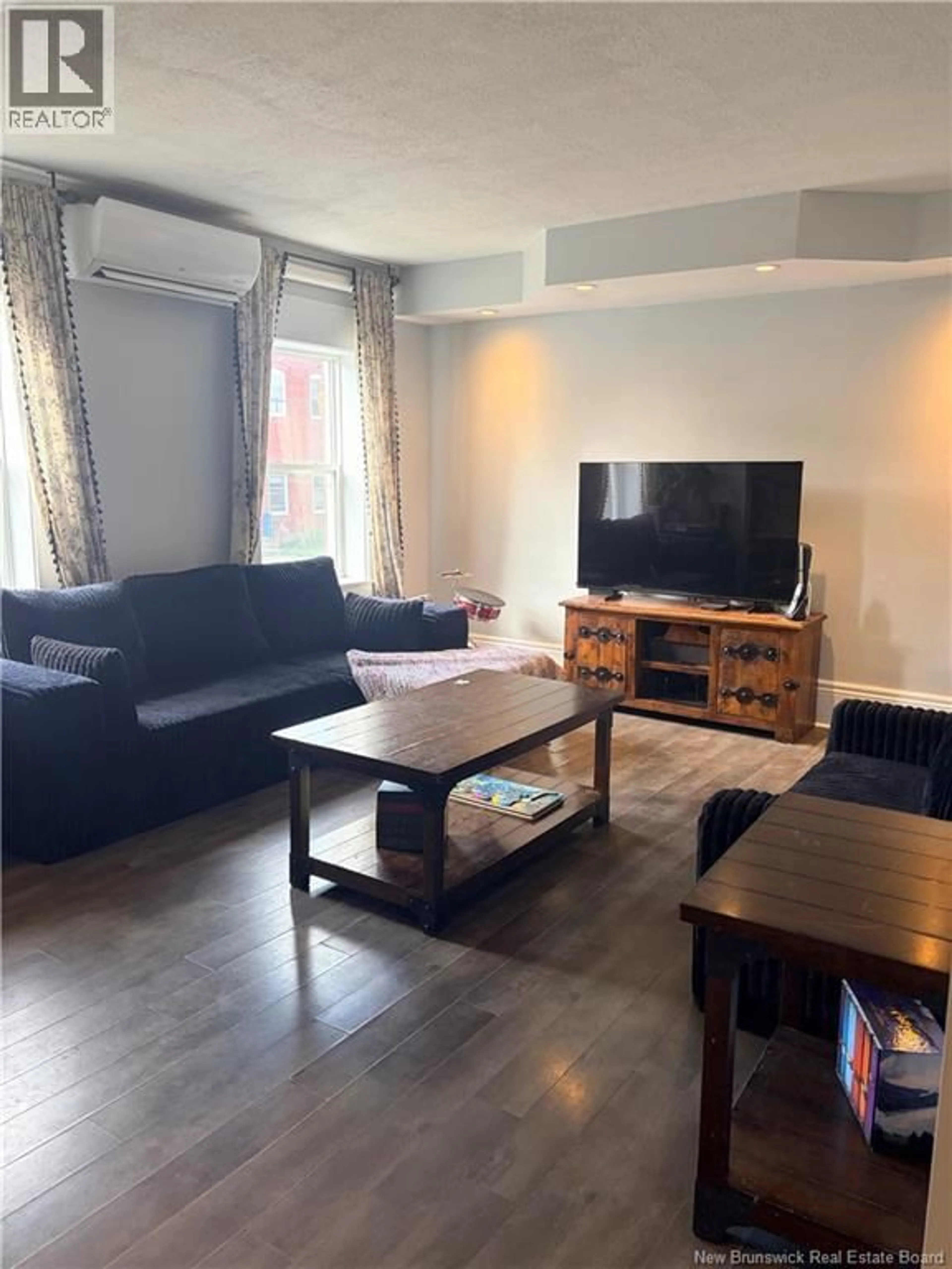 Living room with furniture, wood/laminate floor for 32 MORRISON STREET, Fredericton New Brunswick E3A4M3