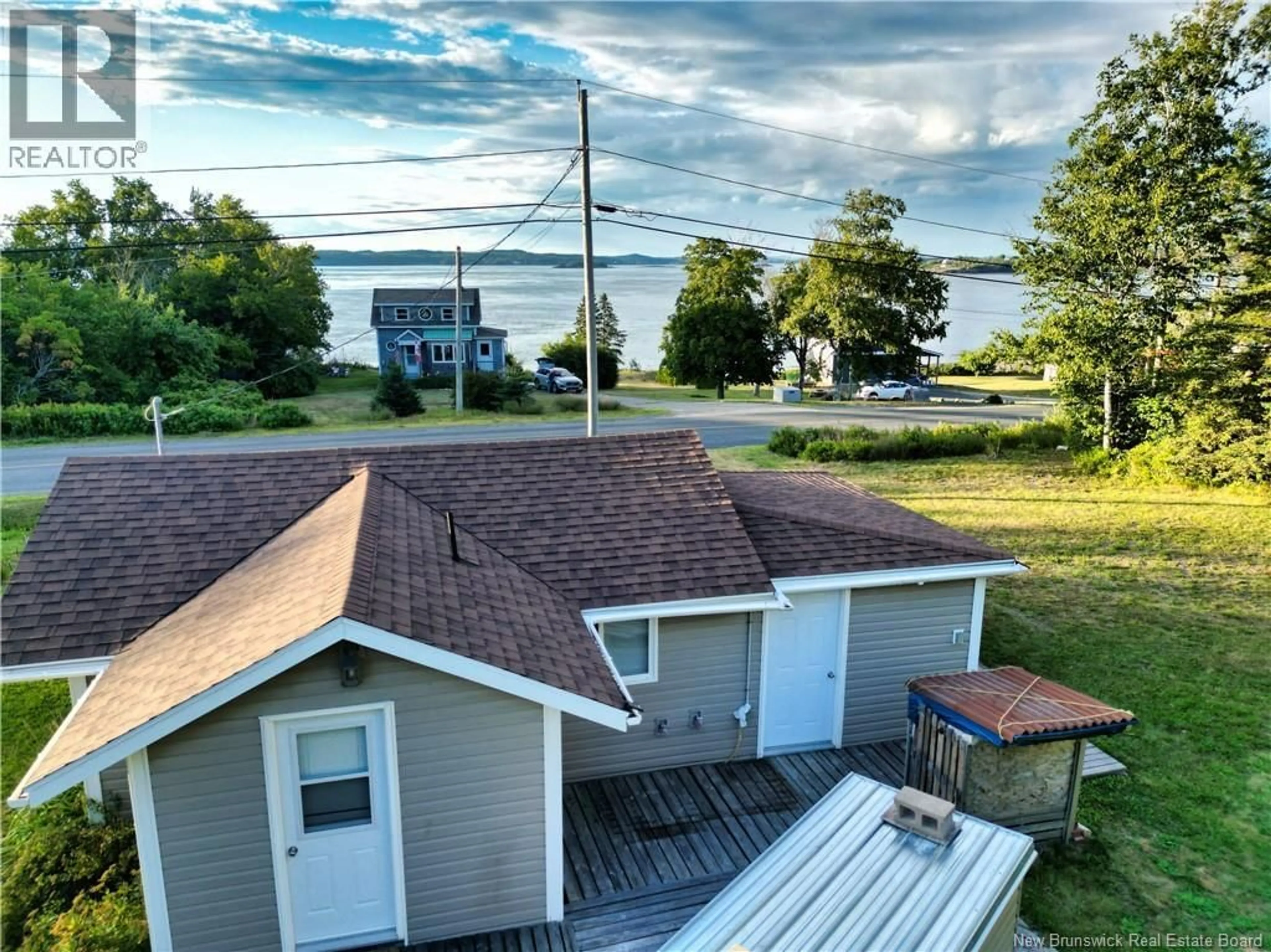 A pic from outside/outdoor area/front of a property/back of a property/a pic from drone, water/lake/river/ocean view for 672 NORTH ROAD, Welshpool New Brunswick E5E1E3