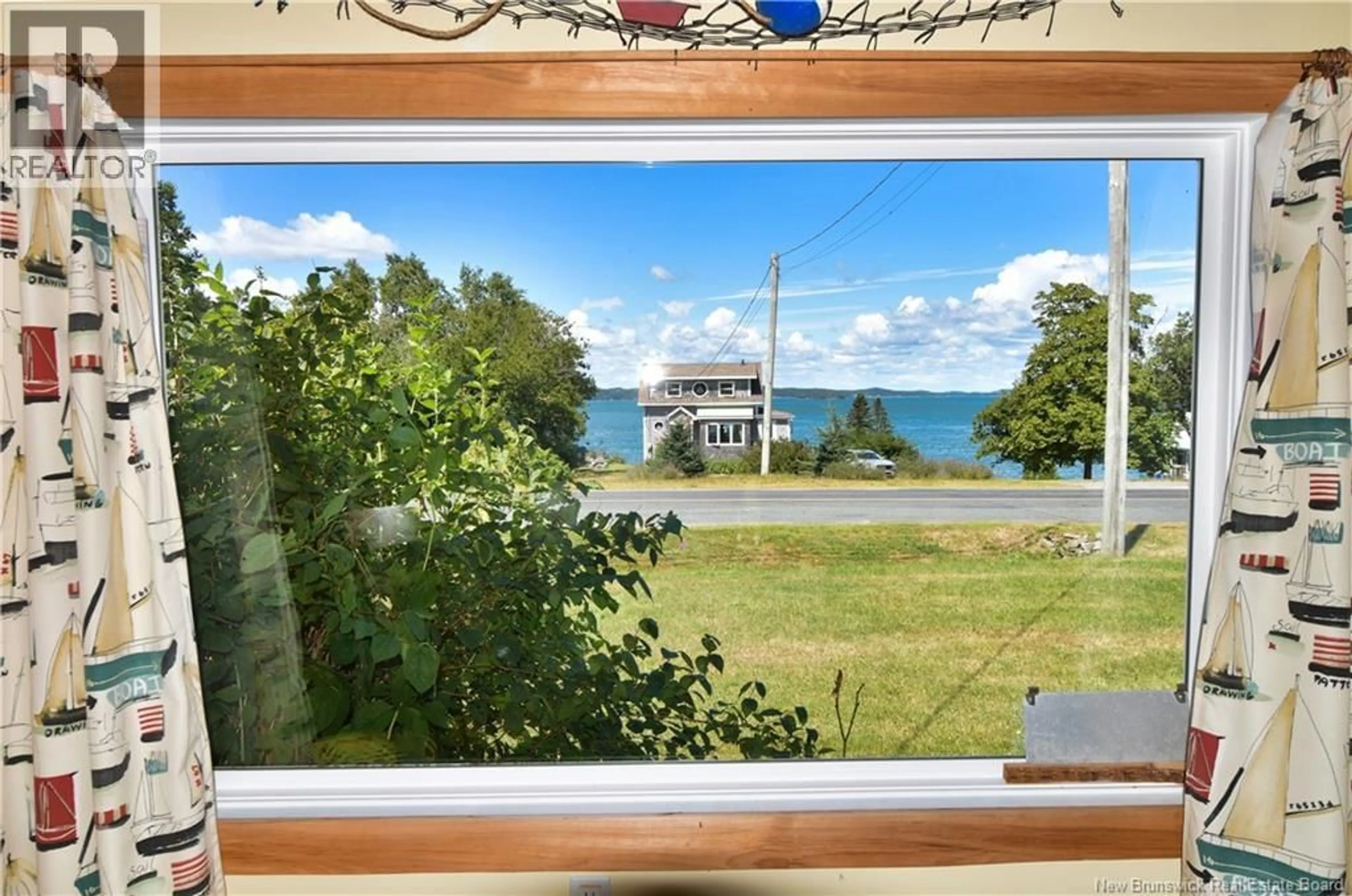 A pic from outside/outdoor area/front of a property/back of a property/a pic from drone, water/lake/river/ocean view for 672 NORTH ROAD, Welshpool New Brunswick E5E1E3