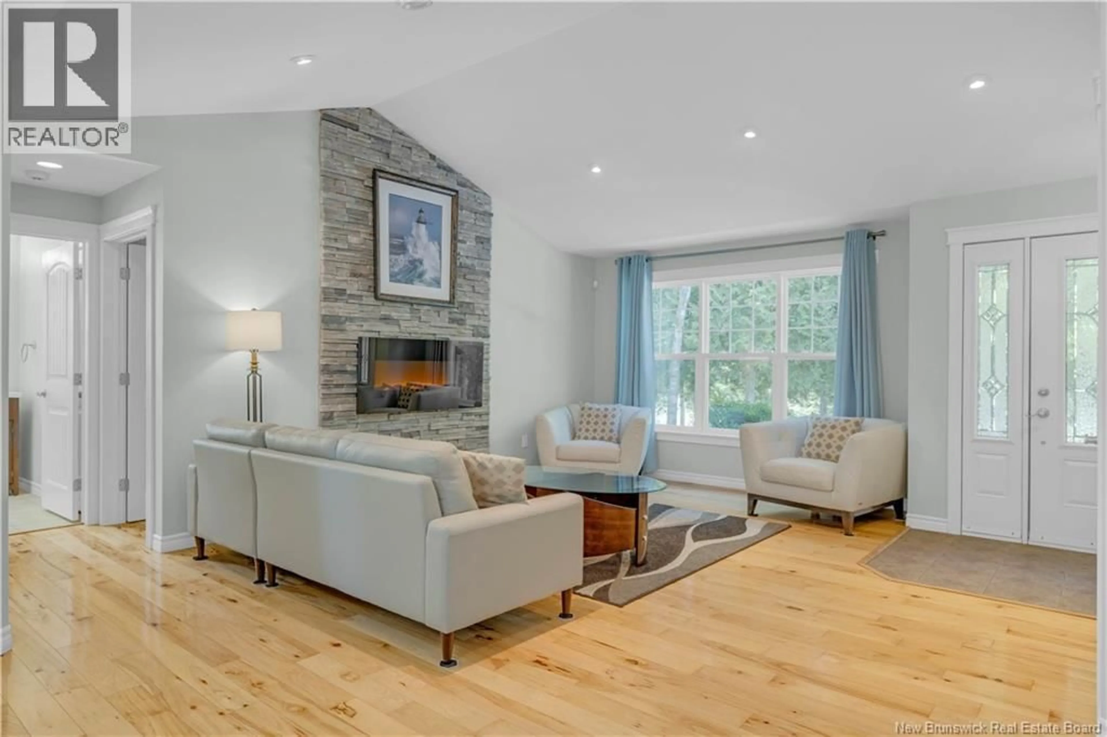 Living room with furniture, wood/laminate floor for 119 ELLIOT ROAD, Quispamsis New Brunswick E2G2B7