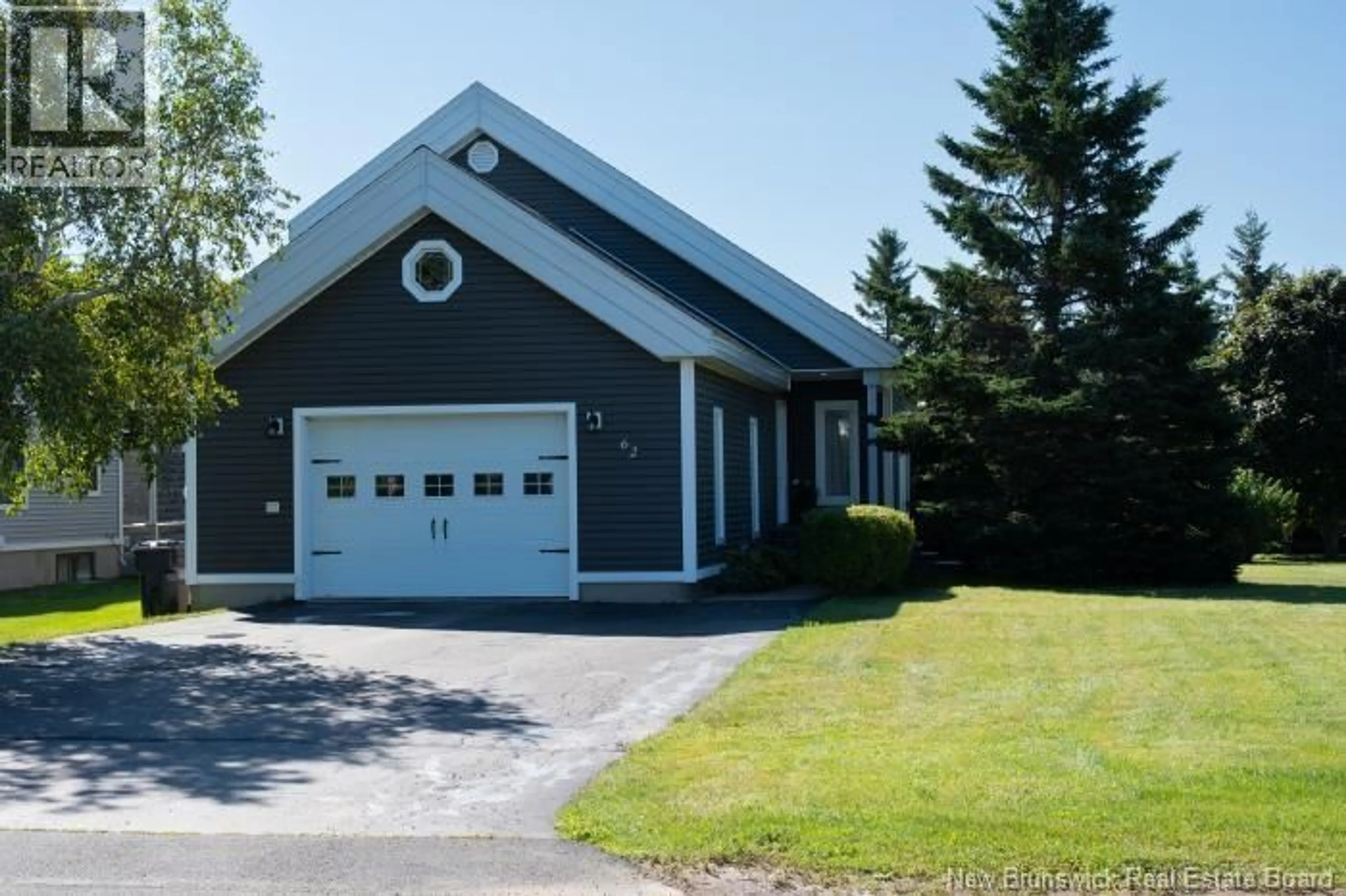 Home with vinyl exterior material, street for 62 PARISE, Caraquet New Brunswick E1W1B6