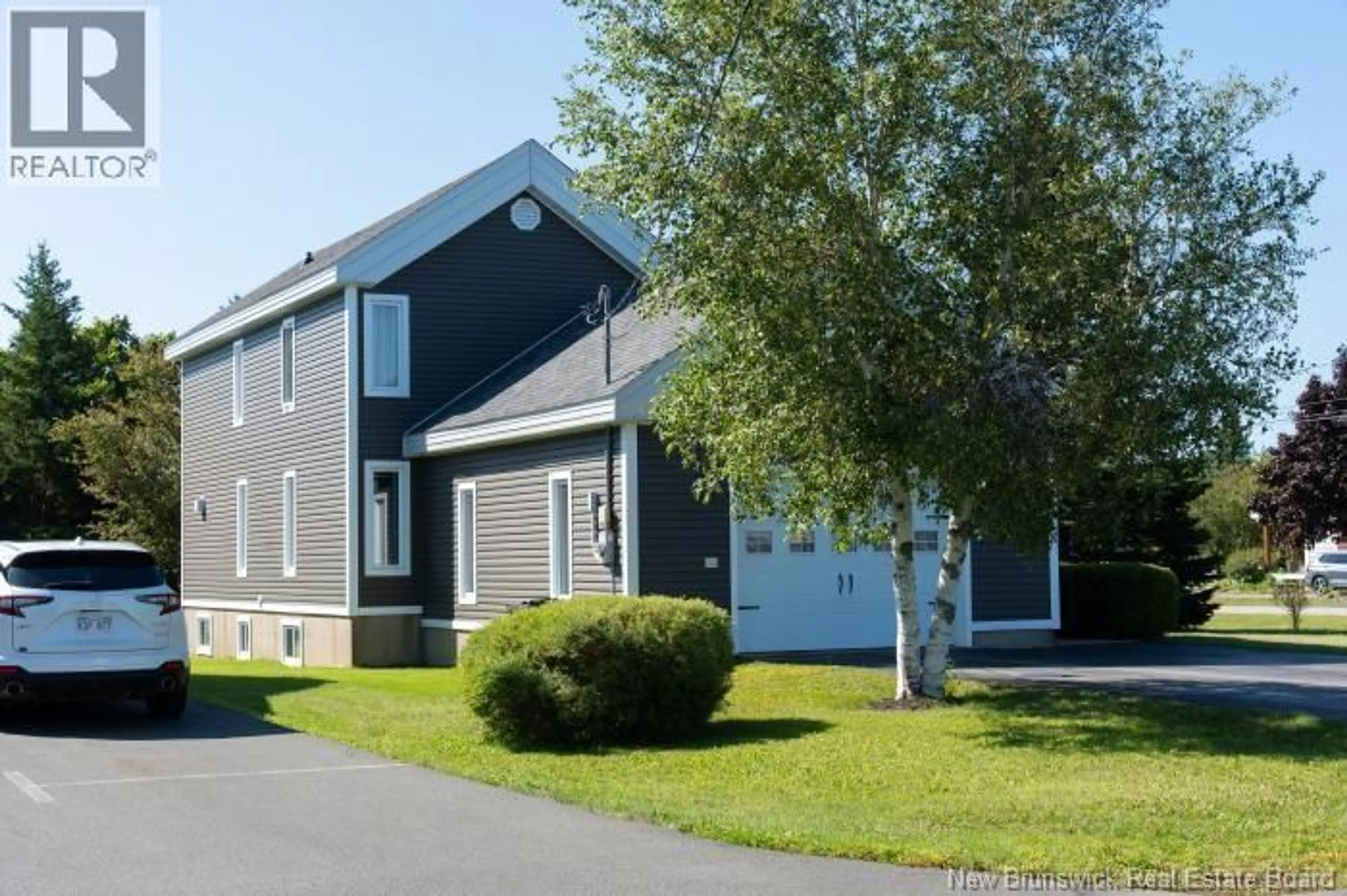 Home with vinyl exterior material, street for 62 PARISE, Caraquet New Brunswick E1W1B6