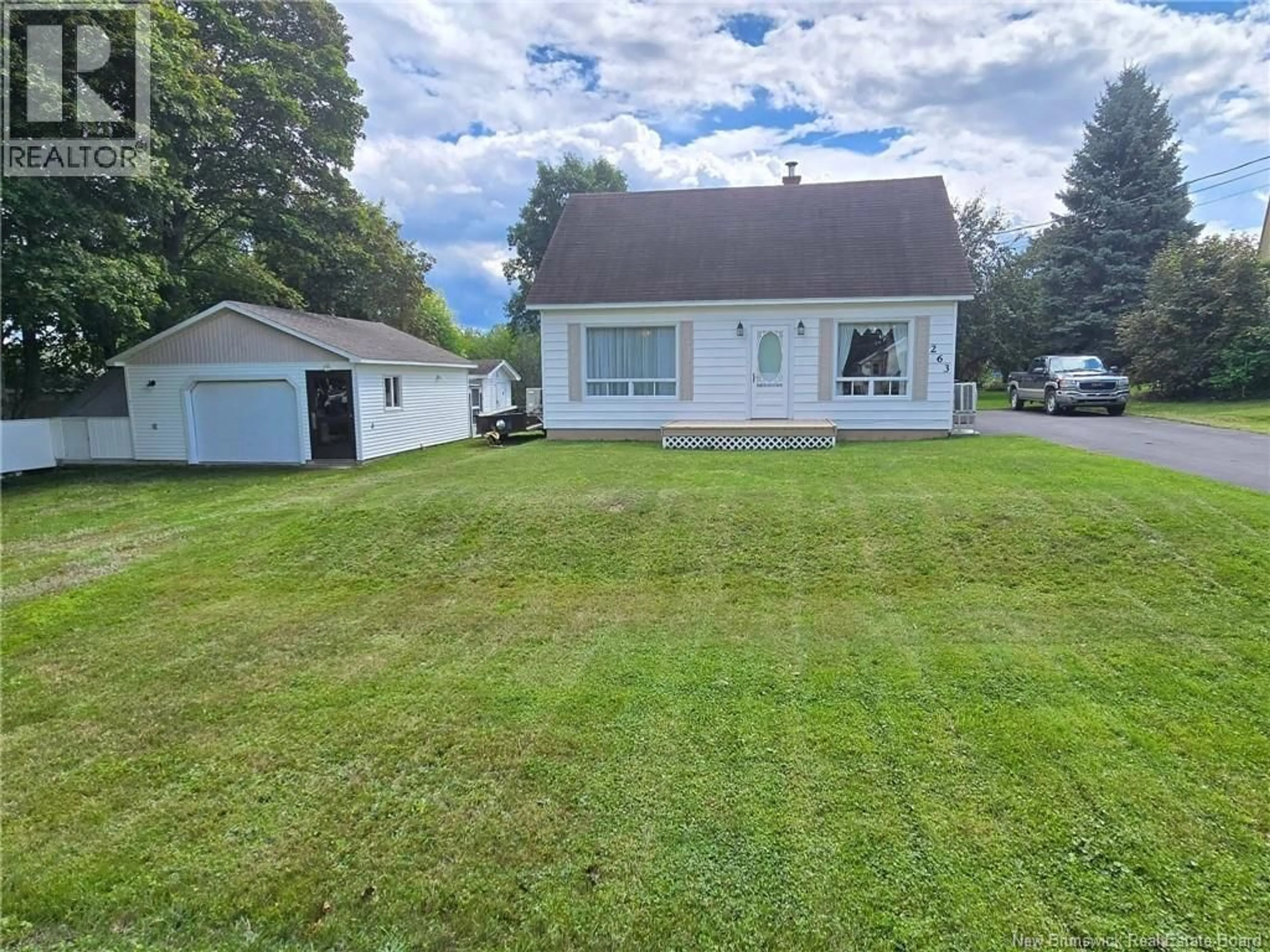 A pic from outside/outdoor area/front of a property/back of a property/a pic from drone, street for 263 PARC, Beresford New Brunswick E8K2E9