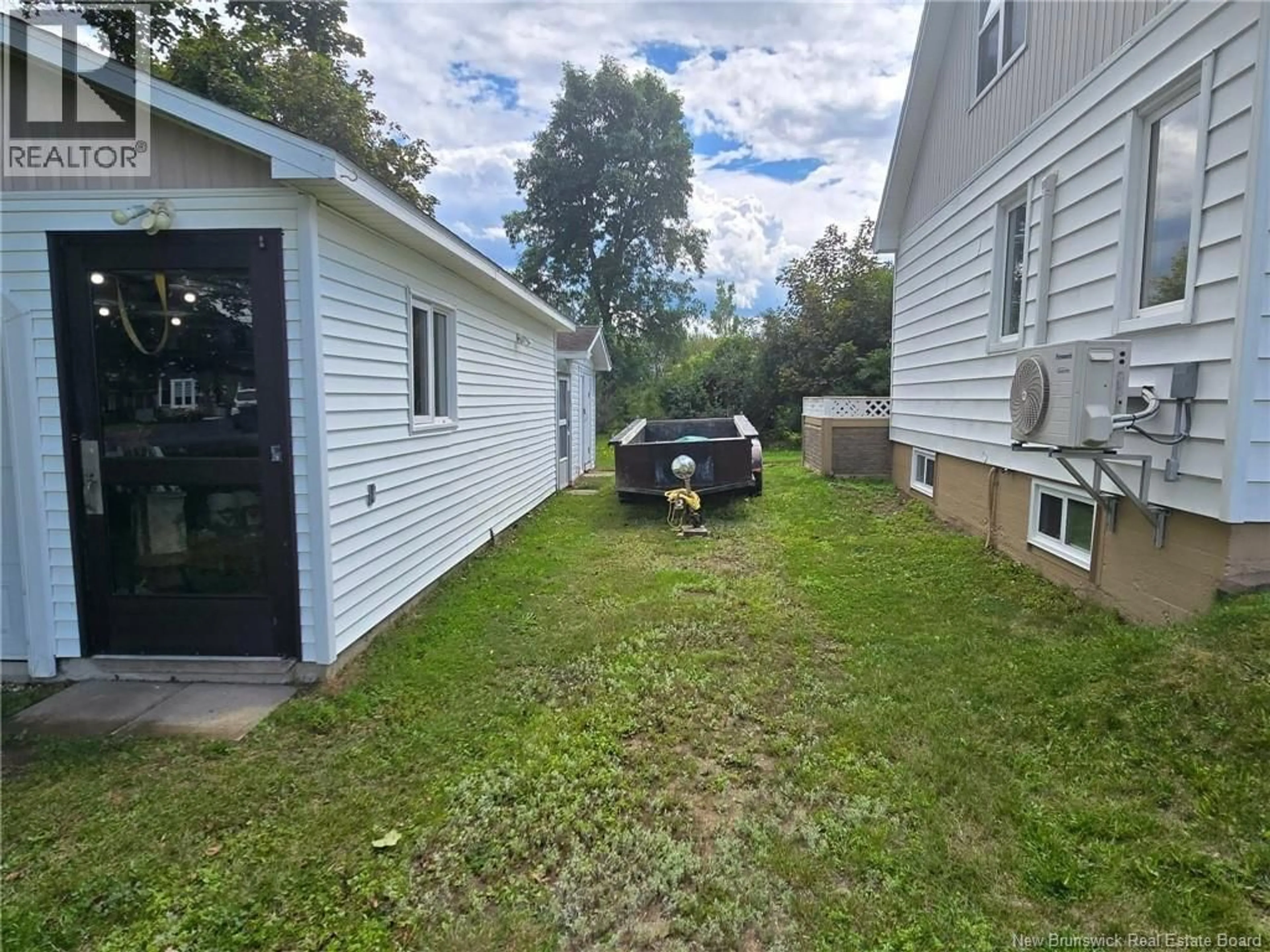 A pic from outside/outdoor area/front of a property/back of a property/a pic from drone, street for 263 PARC, Beresford New Brunswick E8K2E9