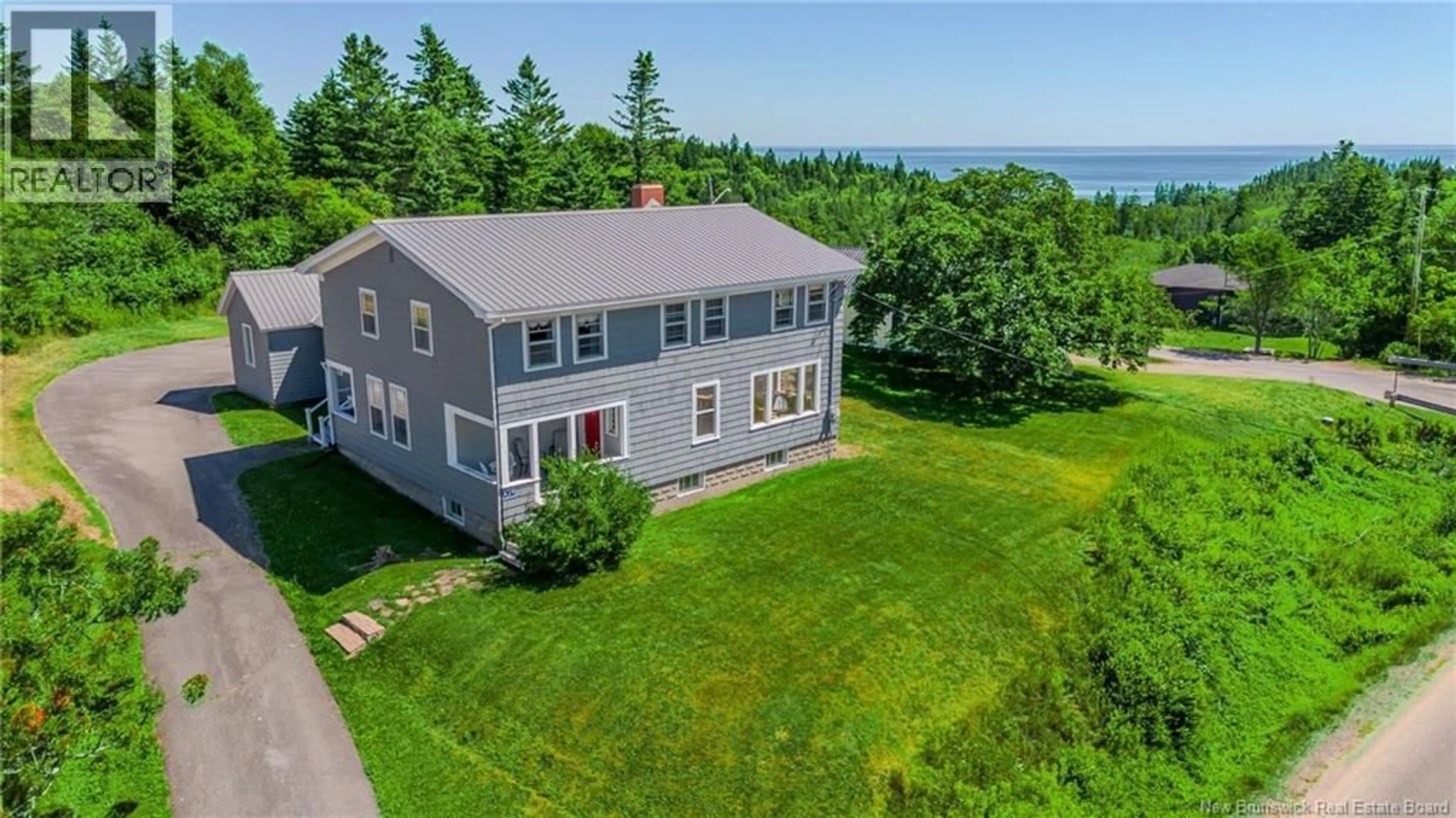 A pic from outside/outdoor area/front of a property/back of a property/a pic from drone, water/lake/river/ocean view for 639 MAIN STREET, Beaver Harbour New Brunswick E5H1N8