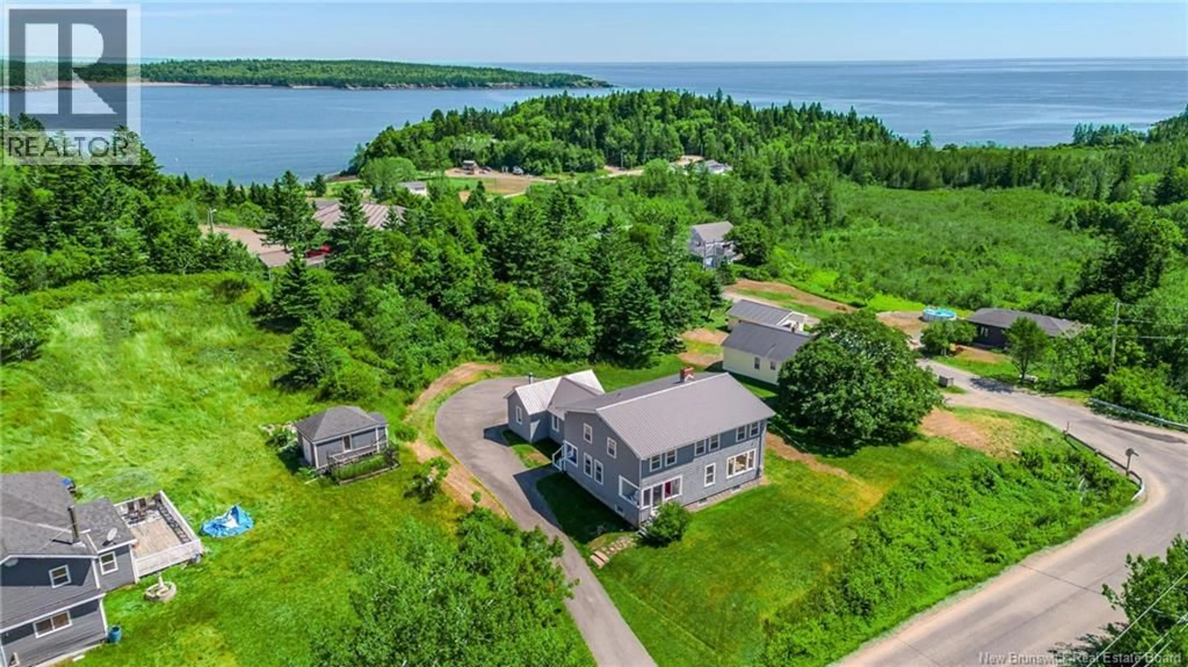 A pic from outside/outdoor area/front of a property/back of a property/a pic from drone, water/lake/river/ocean view for 639 MAIN STREET, Beaver Harbour New Brunswick E5H1N8