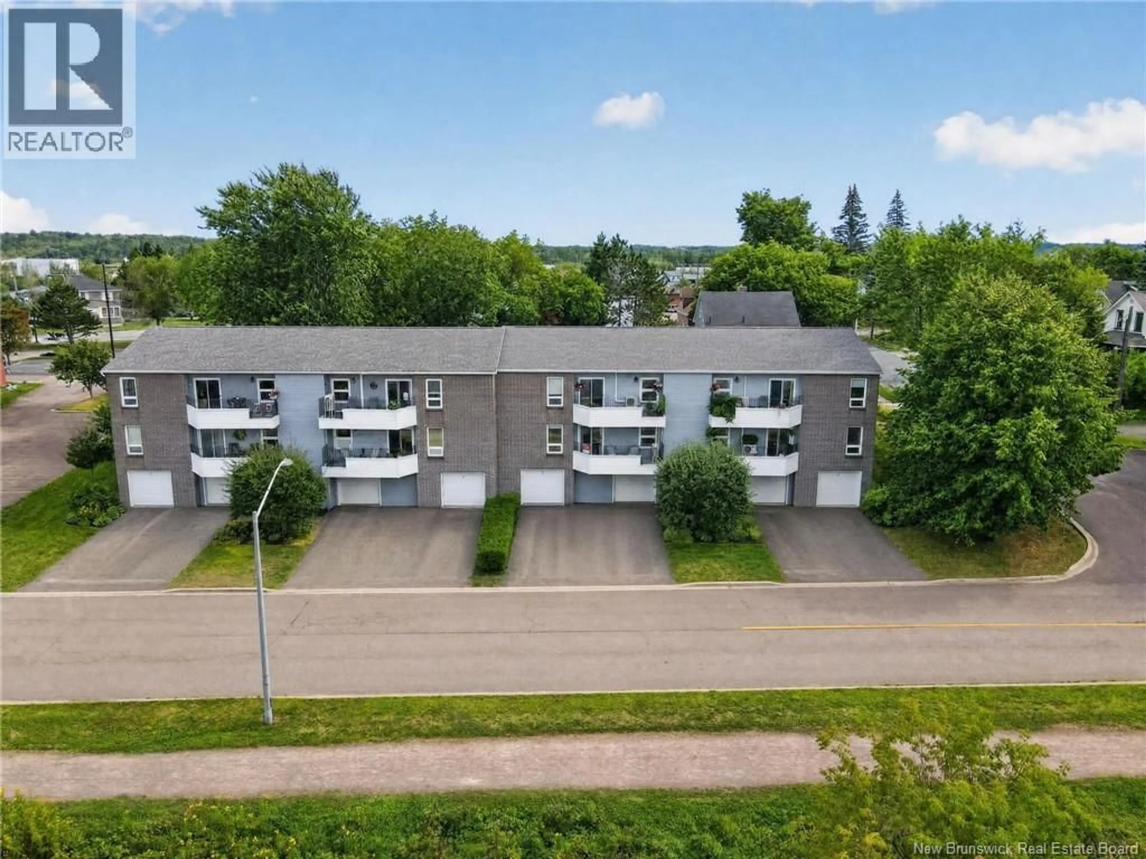 A pic from outside/outdoor area/front of a property/back of a property/a pic from drone, street for 1 - 60 WESTMOUNT BOULEVARD, Moncton New Brunswick E1E4G8
