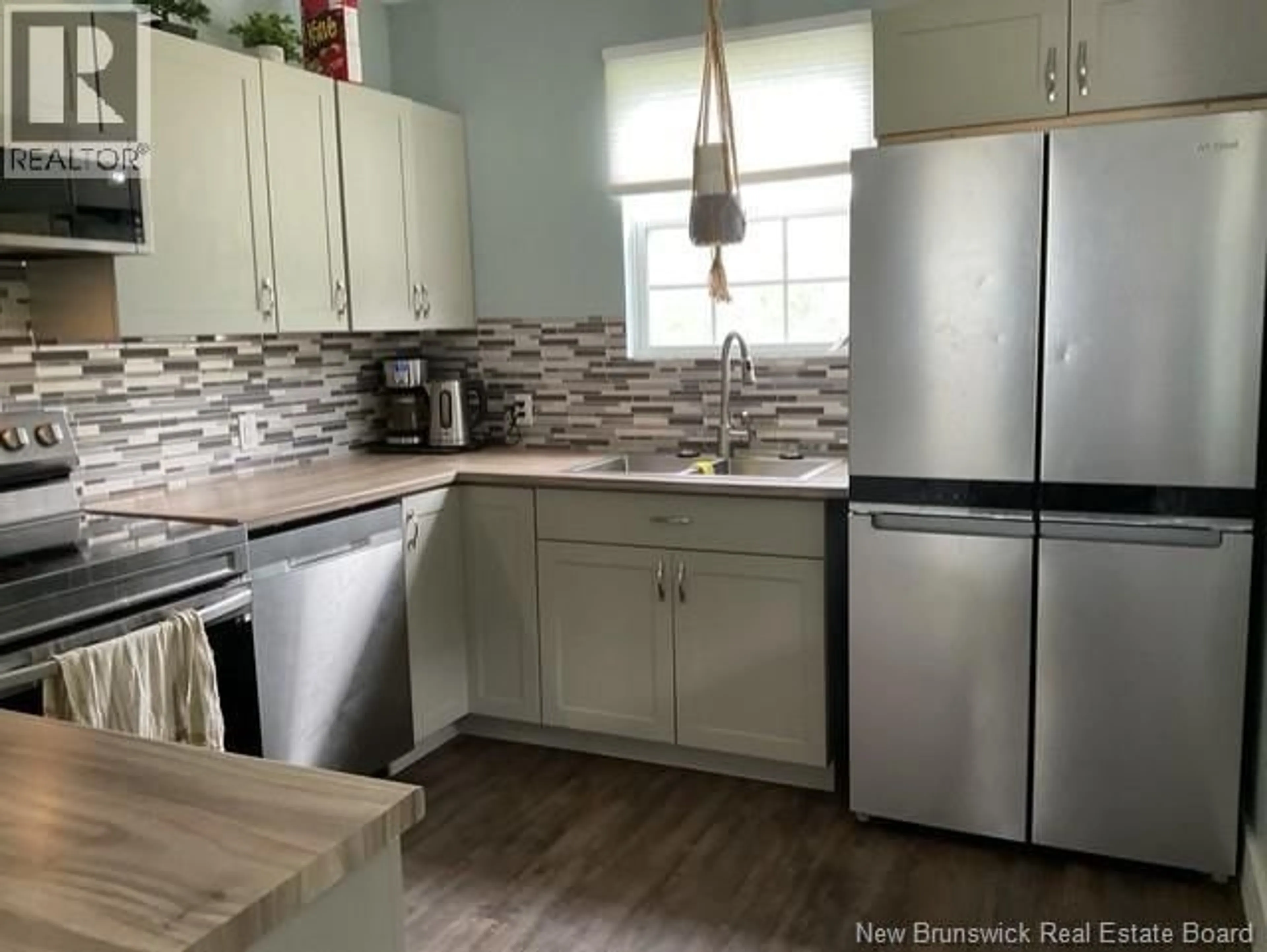 Open concept kitchen, wood/laminate floor for 64 TEED ROAD, Mapledale New Brunswick E7M4T4
