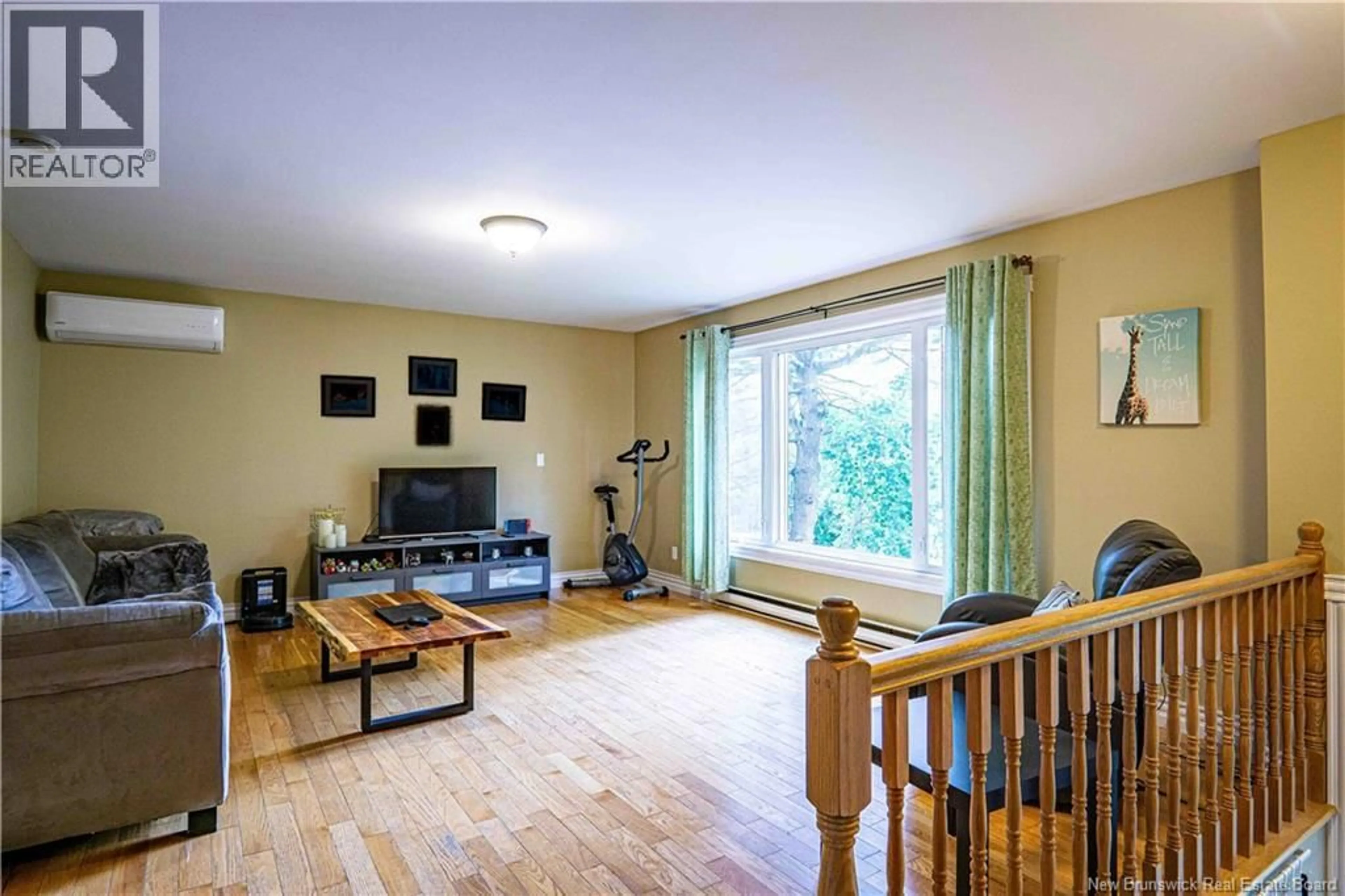 Living room with furniture, wood/laminate floor for 770 GLENGARRY PLACE, Fredericton New Brunswick E3B5Z9