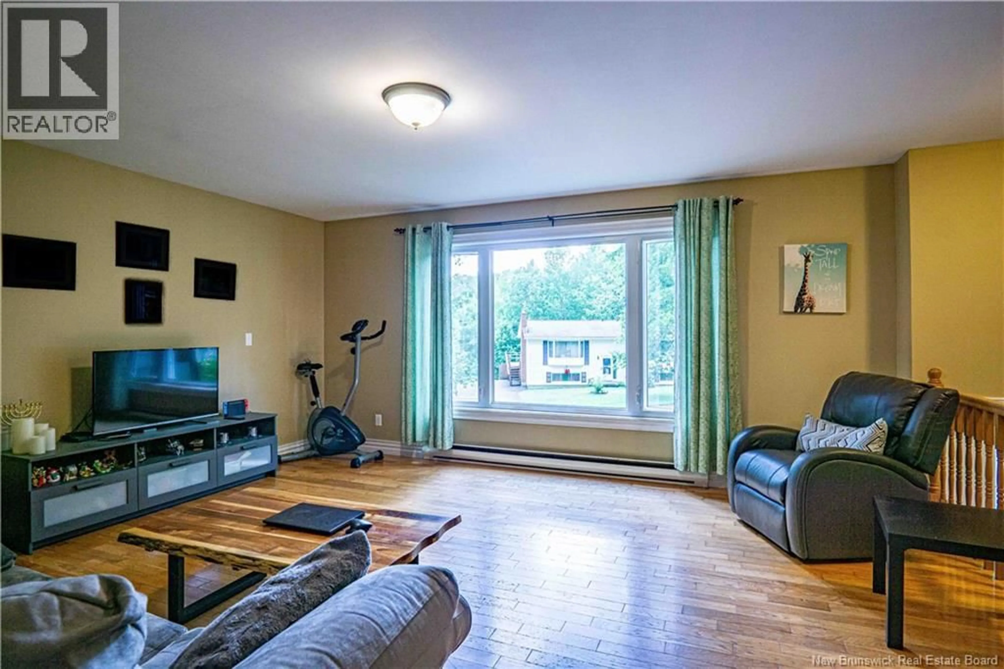 Living room with furniture, wood/laminate floor for 770 GLENGARRY PLACE, Fredericton New Brunswick E3B5Z9