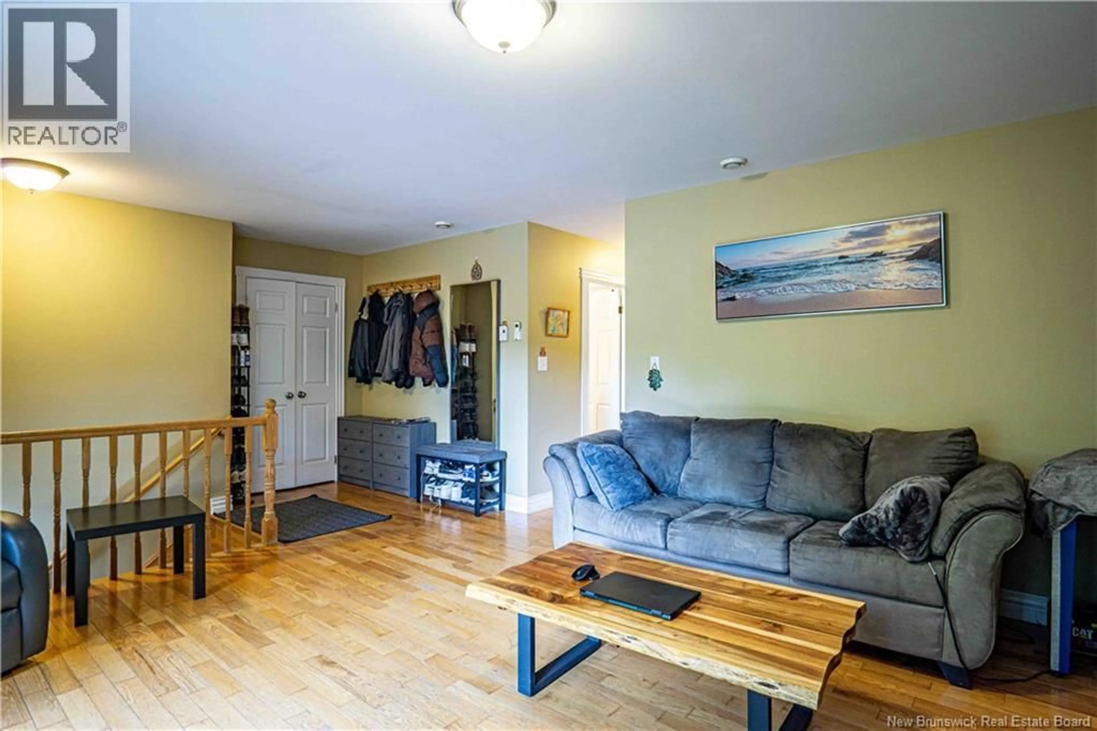 Living room with furniture, wood/laminate floor for 770 GLENGARRY PLACE, Fredericton New Brunswick E3B5Z9
