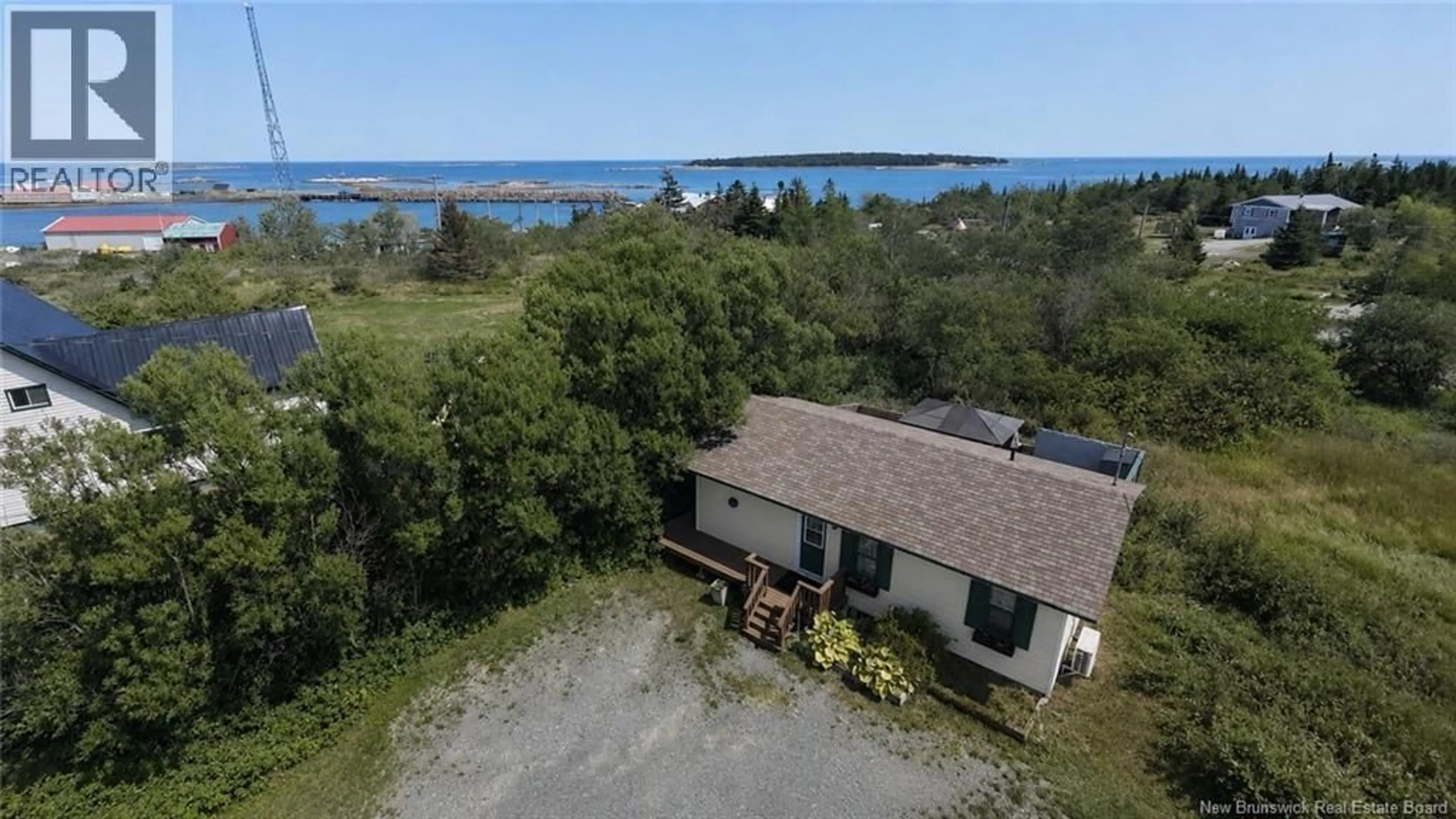 A pic from outside/outdoor area/front of a property/back of a property/a pic from drone, water/lake/river/ocean view for 905 ROUTE 776, Grand Manan New Brunswick E5G4L3