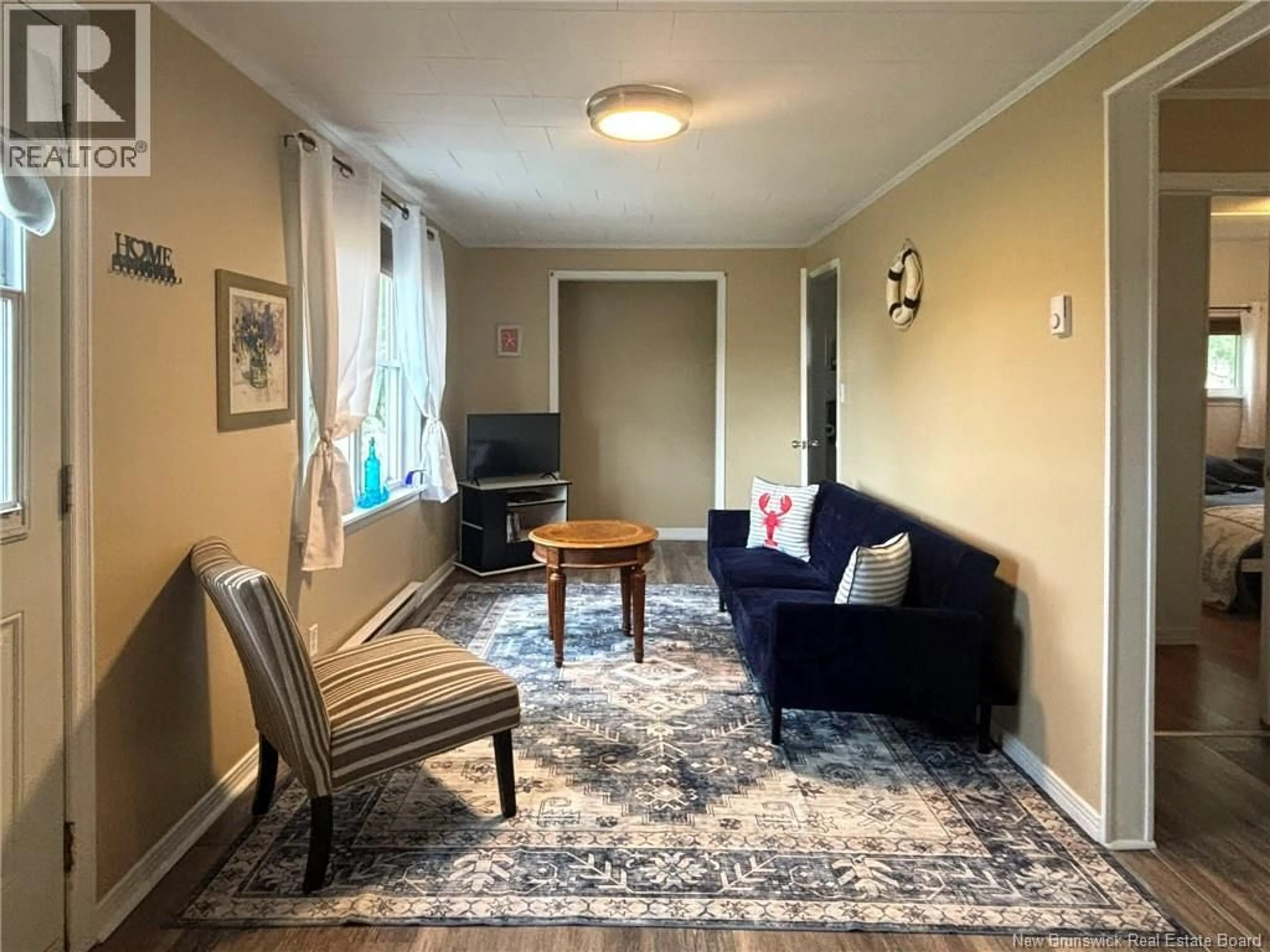 Living room with furniture, unknown for 71 THOROUGHFARE ROAD, Grand Manan New Brunswick E5G1G5