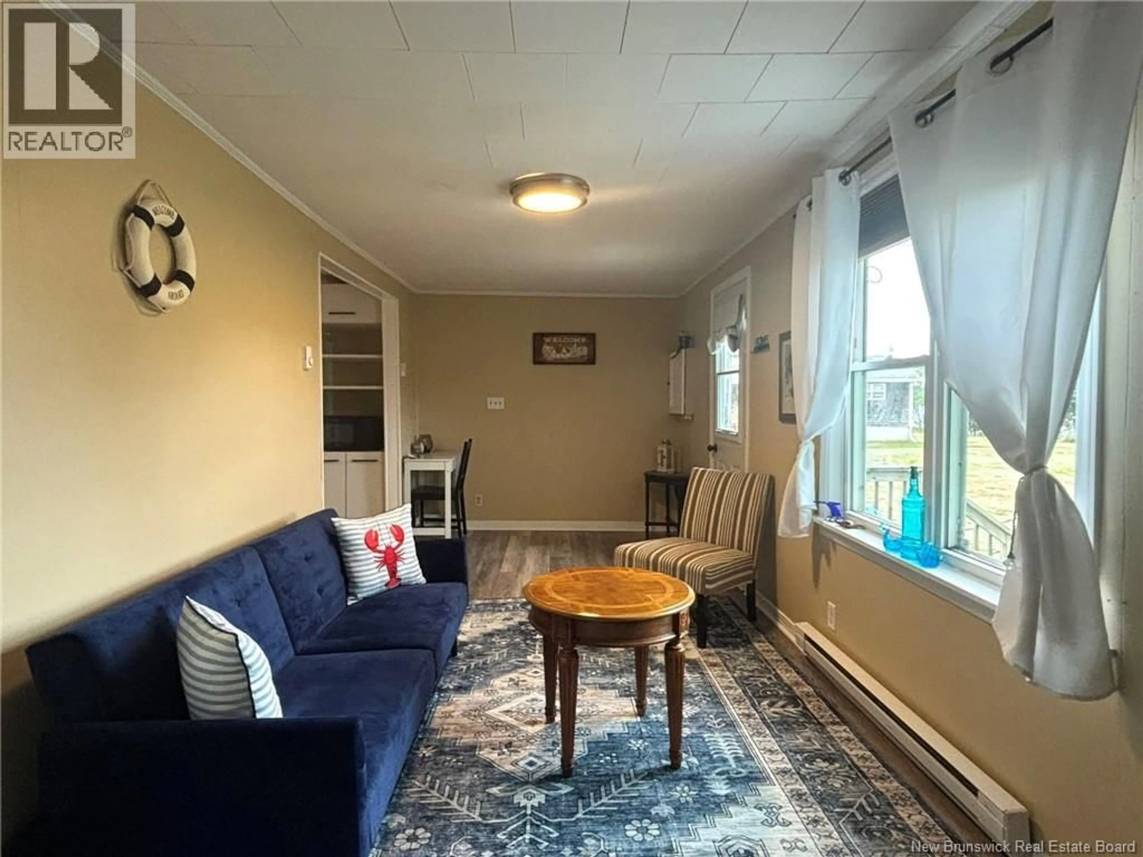 Living room with furniture, unknown for 71 THOROUGHFARE ROAD, Grand Manan New Brunswick E5G1G5
