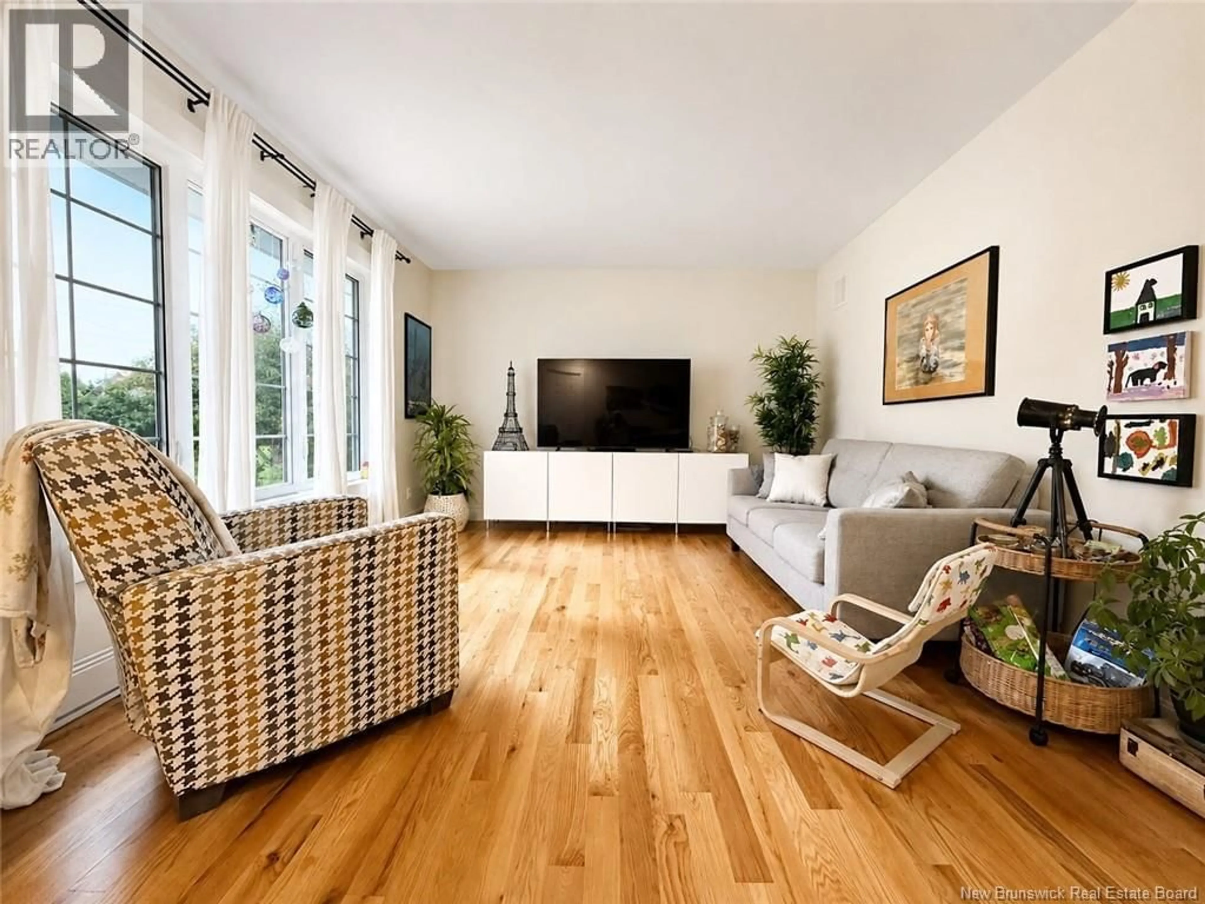 Living room with furniture, wood/laminate floor for 11 CHARLES, Rogersville New Brunswick E4Y2E3