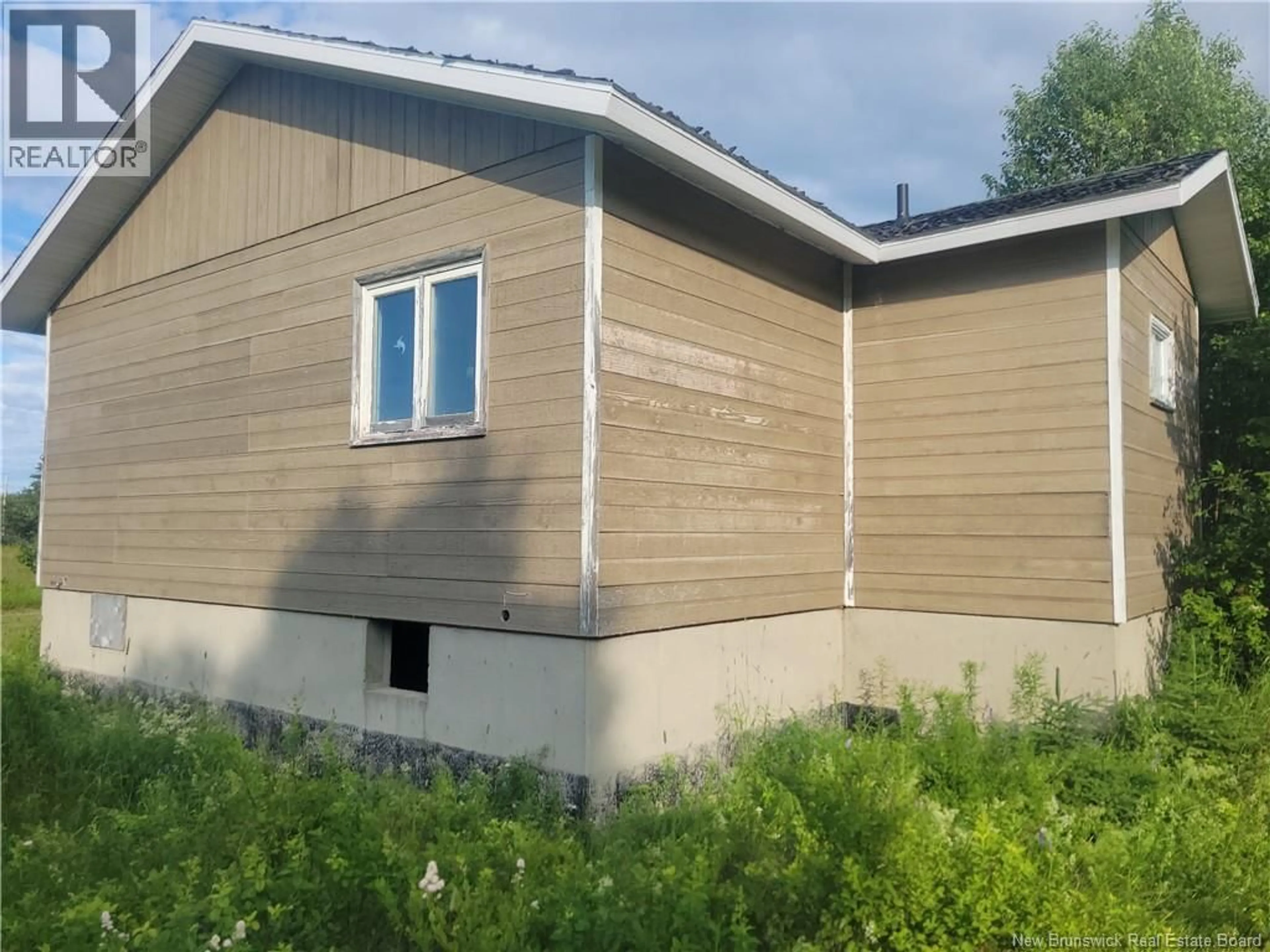Home with vinyl exterior material, building for 20 POKESUDIE ROAD, Pokesudie New Brunswick E1W5T5