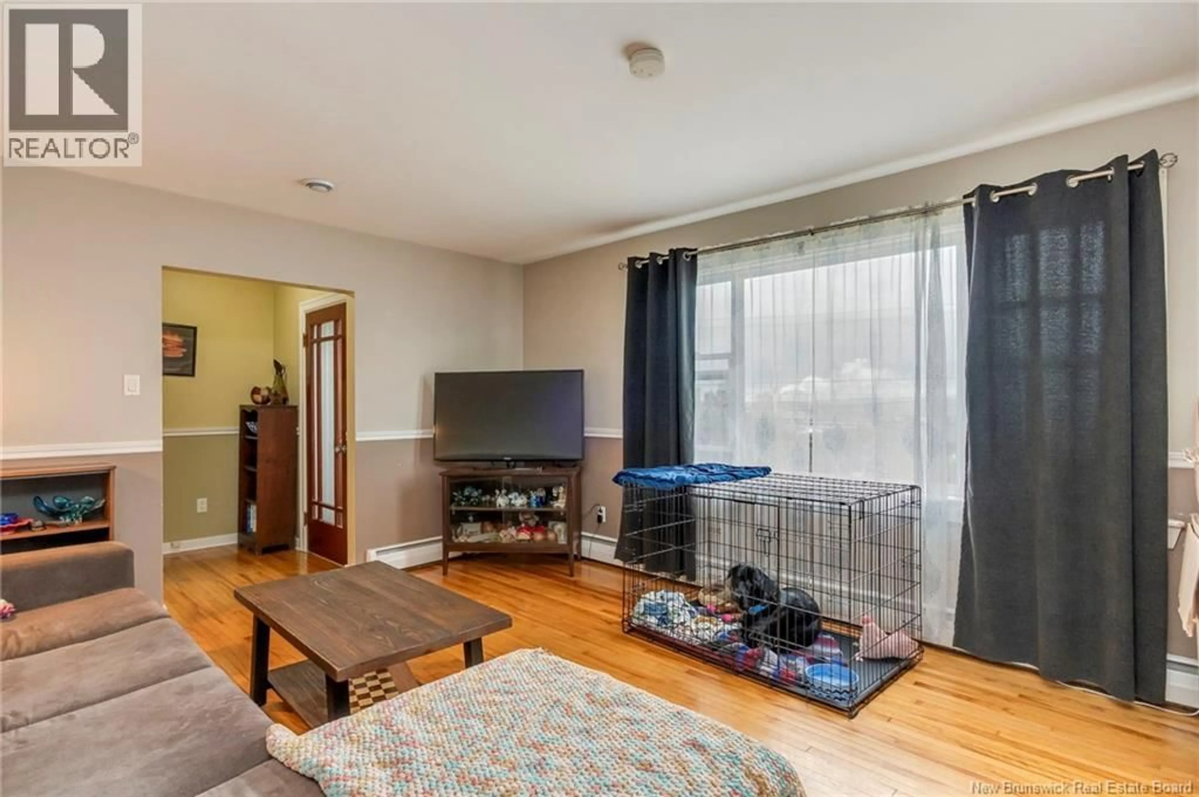 Living room with furniture, wood/laminate floor for 490 LANCASTER AVENUE, Saint John New Brunswick E2M2L7