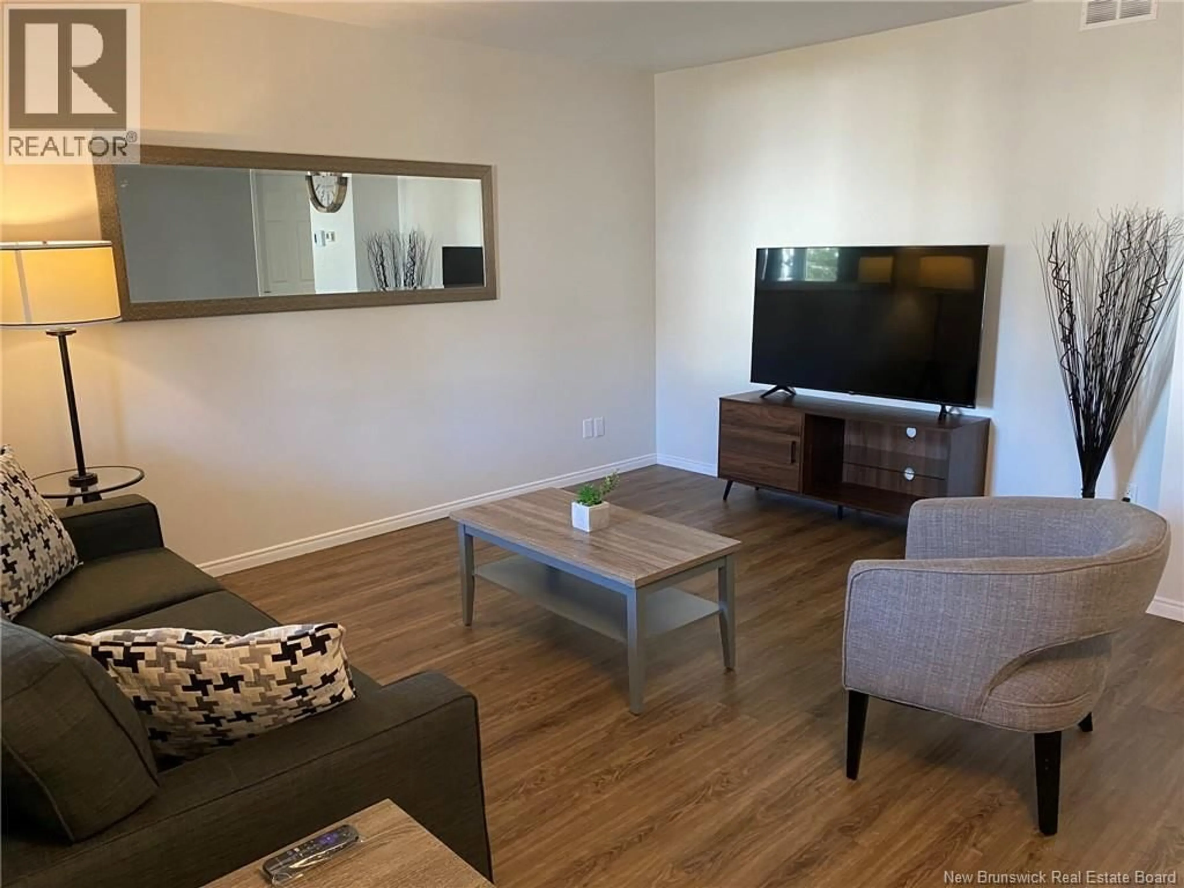 Living room with furniture, wood/laminate floor for 35 MONAGHAN DRIVE, Moncton New Brunswick E1A6H8