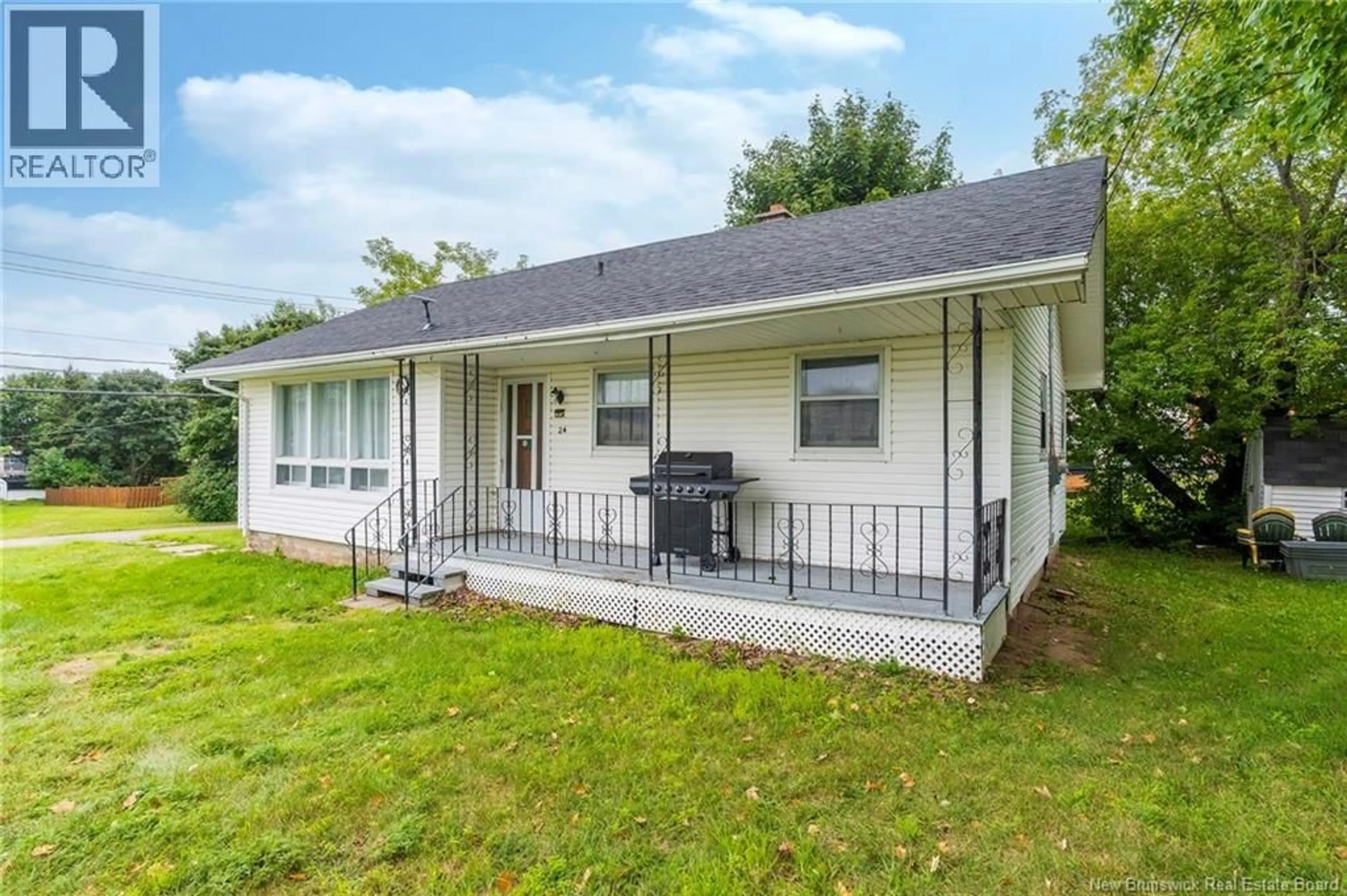 Home with vinyl exterior material, street for 24 RUE DE L'EGLISE, Bouctouche New Brunswick E4S2Z8