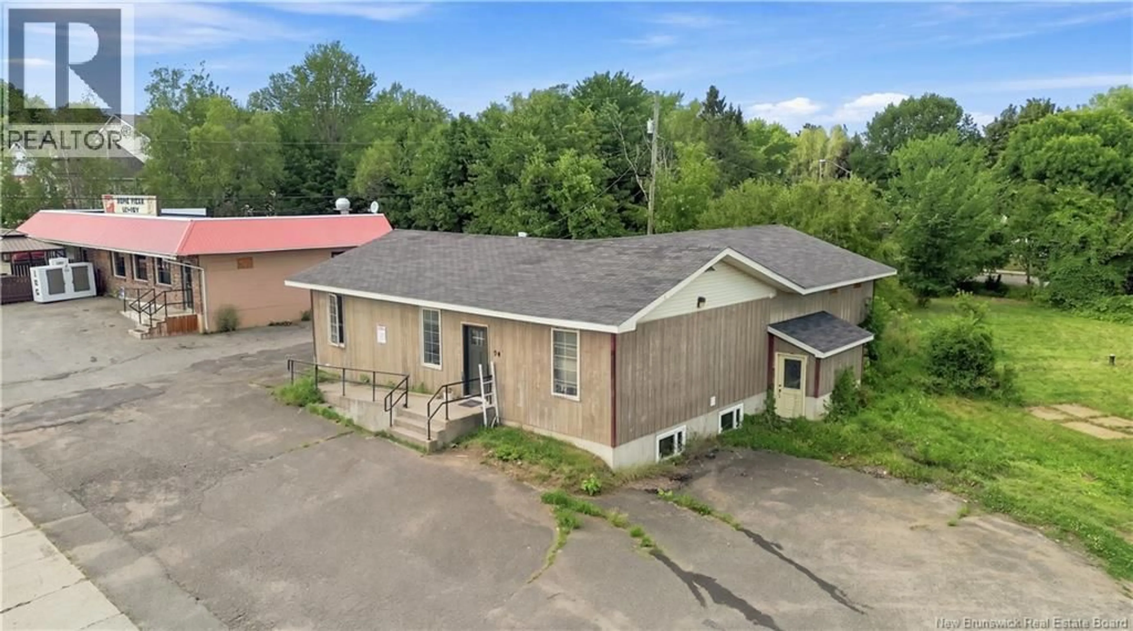 A pic from outside/outdoor area/front of a property/back of a property/a pic from drone, building for 214 MAIN STREET, Minto New Brunswick E4B3R3