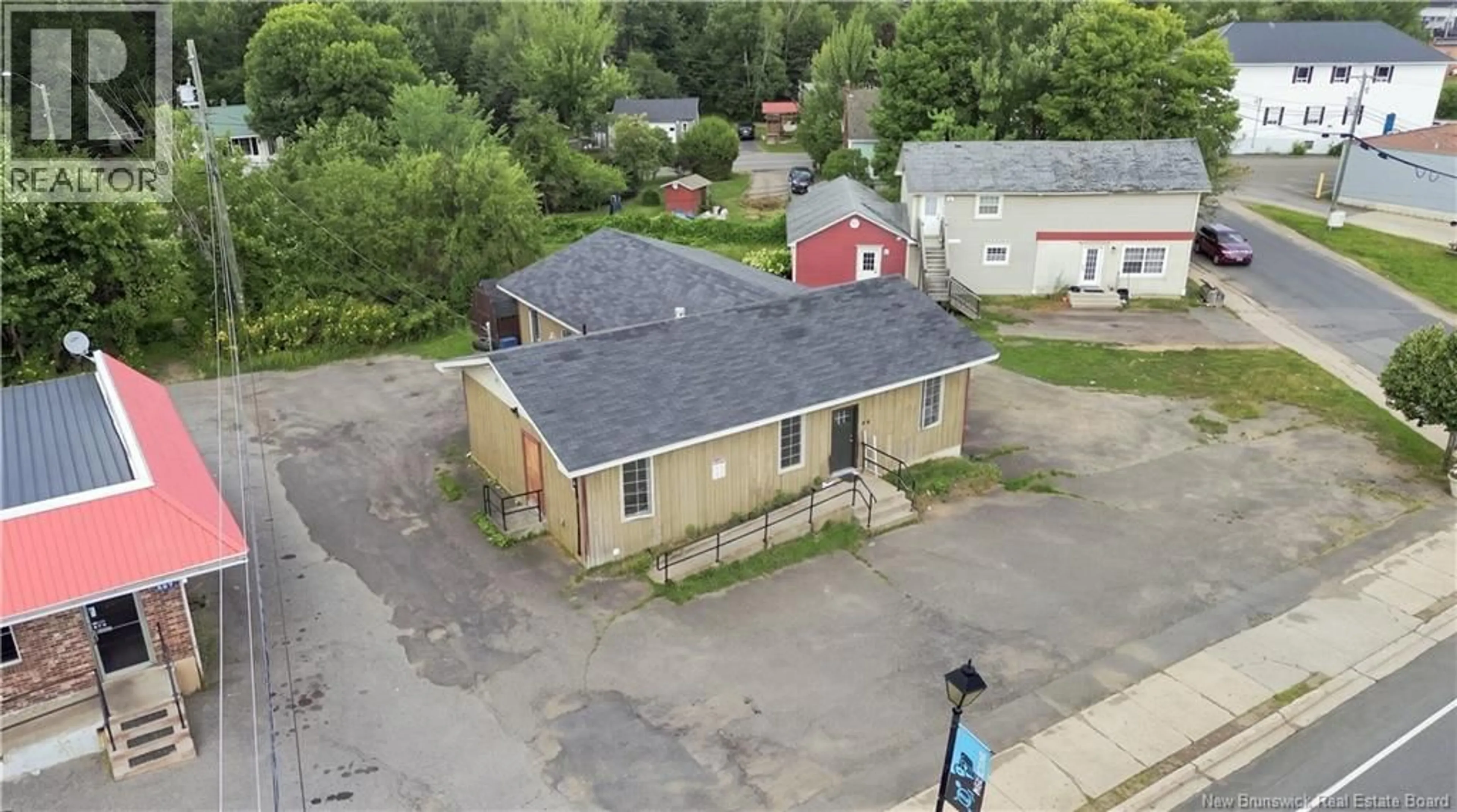 A pic from outside/outdoor area/front of a property/back of a property/a pic from drone, building for 214 MAIN STREET, Minto New Brunswick E4B3R3